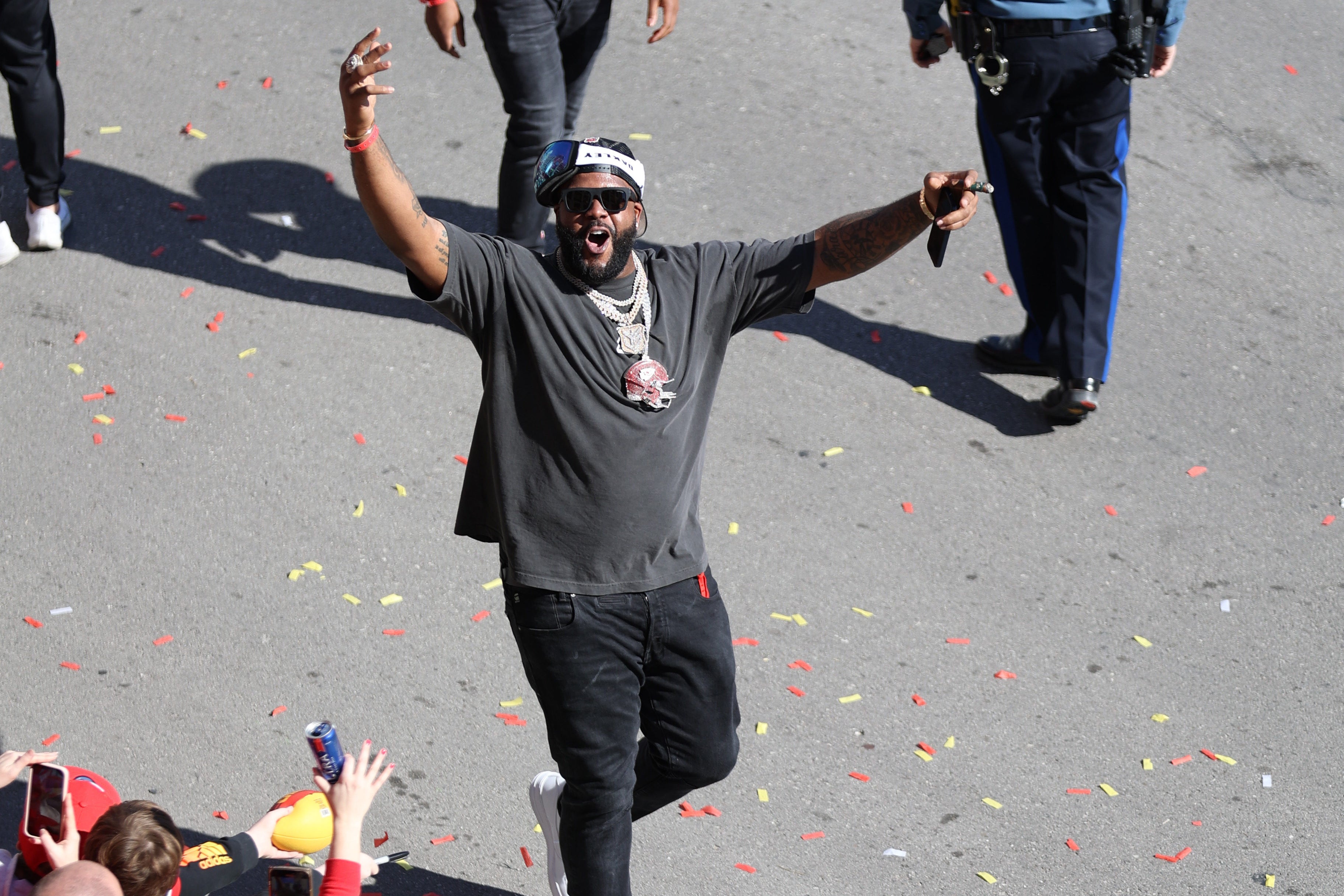 Feb 14, 2024; Kansas City, MO, USA; Kansas City Chiefs offensive tackle Donovan Smith (79) celebrates with fans on the street in the parade during the celebration of the Kansas City Chiefs winning Super Bowl LVIII.