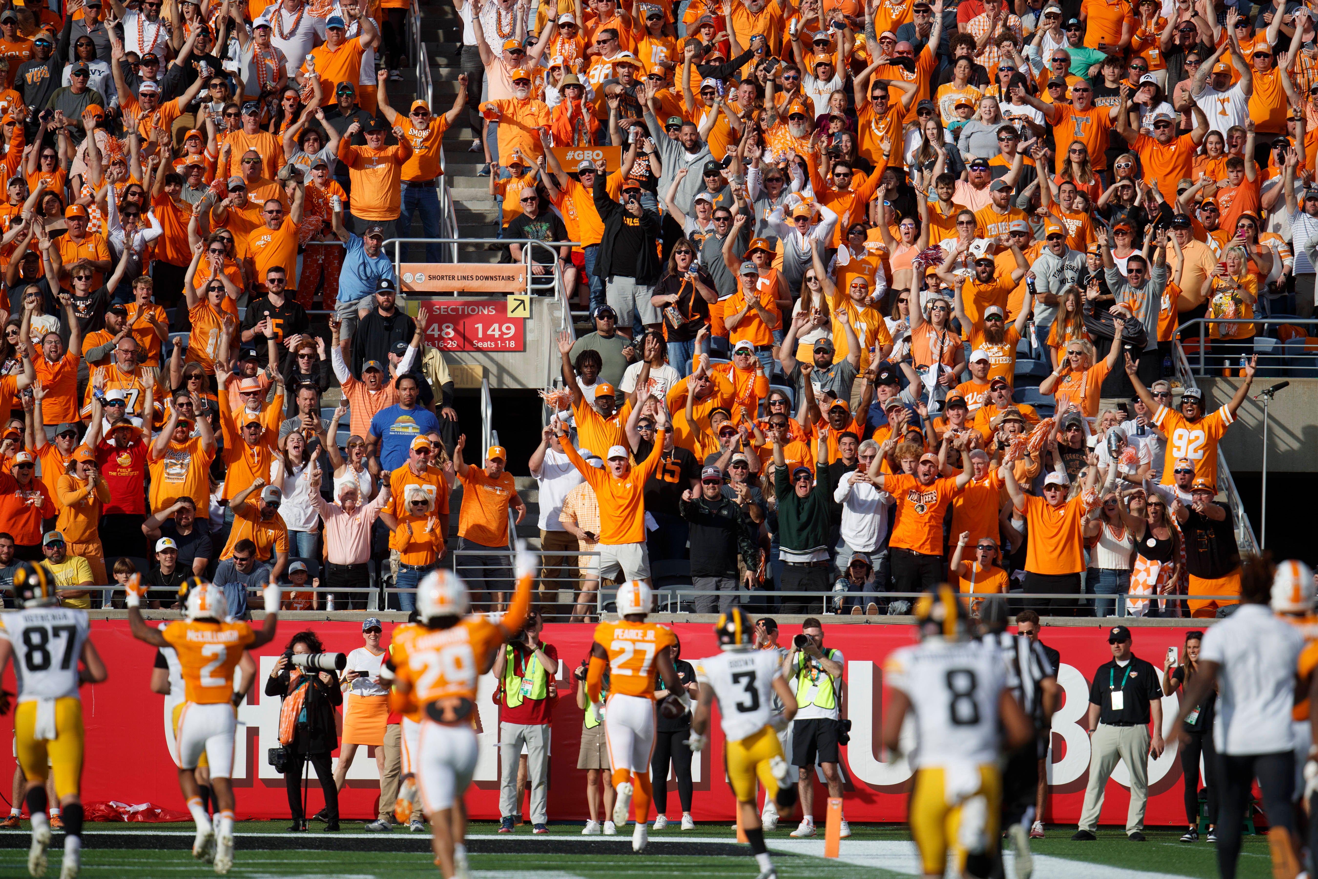 Jan 1, 2024; Orlando, FL, USA; Tennessee Volunteers defensive lineman James Pearce Jr. (27) scores a touchdown from an interception against the Iowa Hawkeyes during the third quarter at Camping World Stadium.
