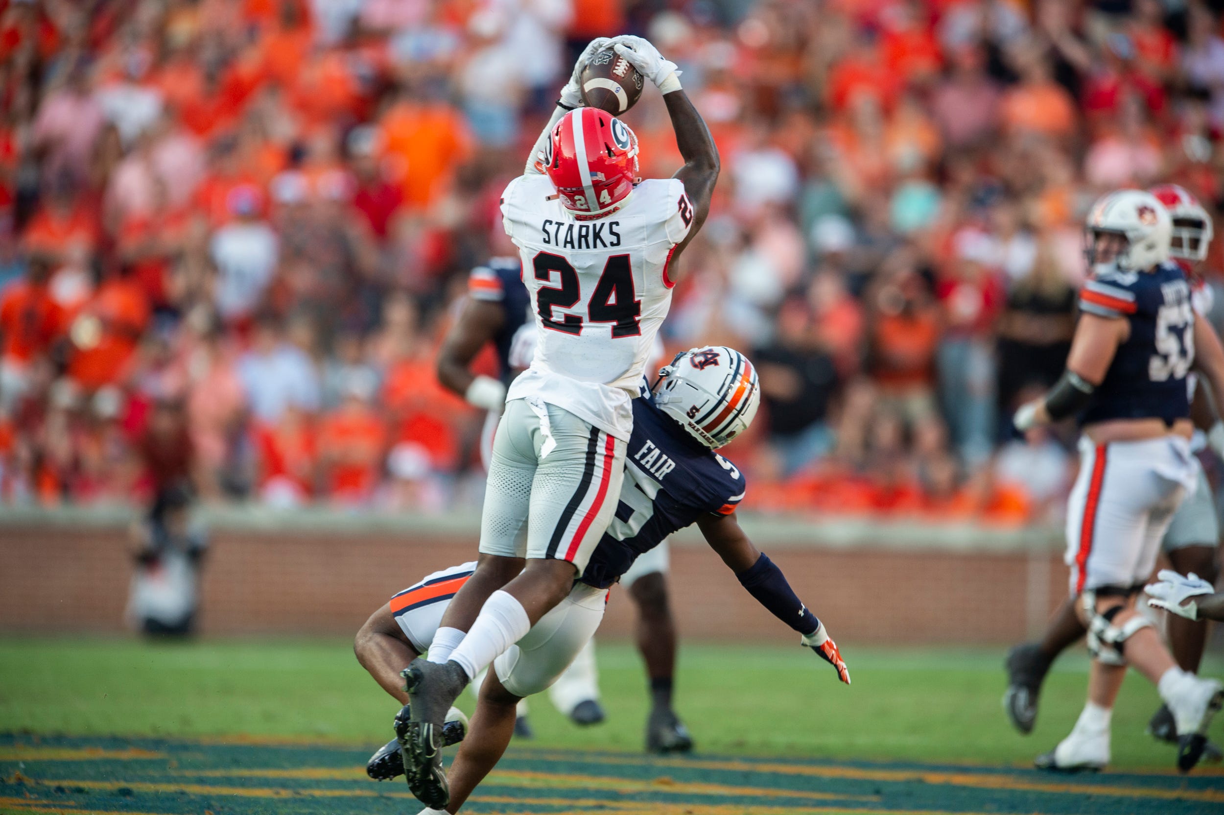 Georgia Bulldogs defensive back Malaki Starks (24) makes the game sealing interception as Auburn Tigers take on Georgia Bulldogs at Jordan-Hare Stadium in Auburn, Ala., on Saturday, Sept. 30, 2023. Georgia Bulldogs defeated Auburn Tigers 27-20.