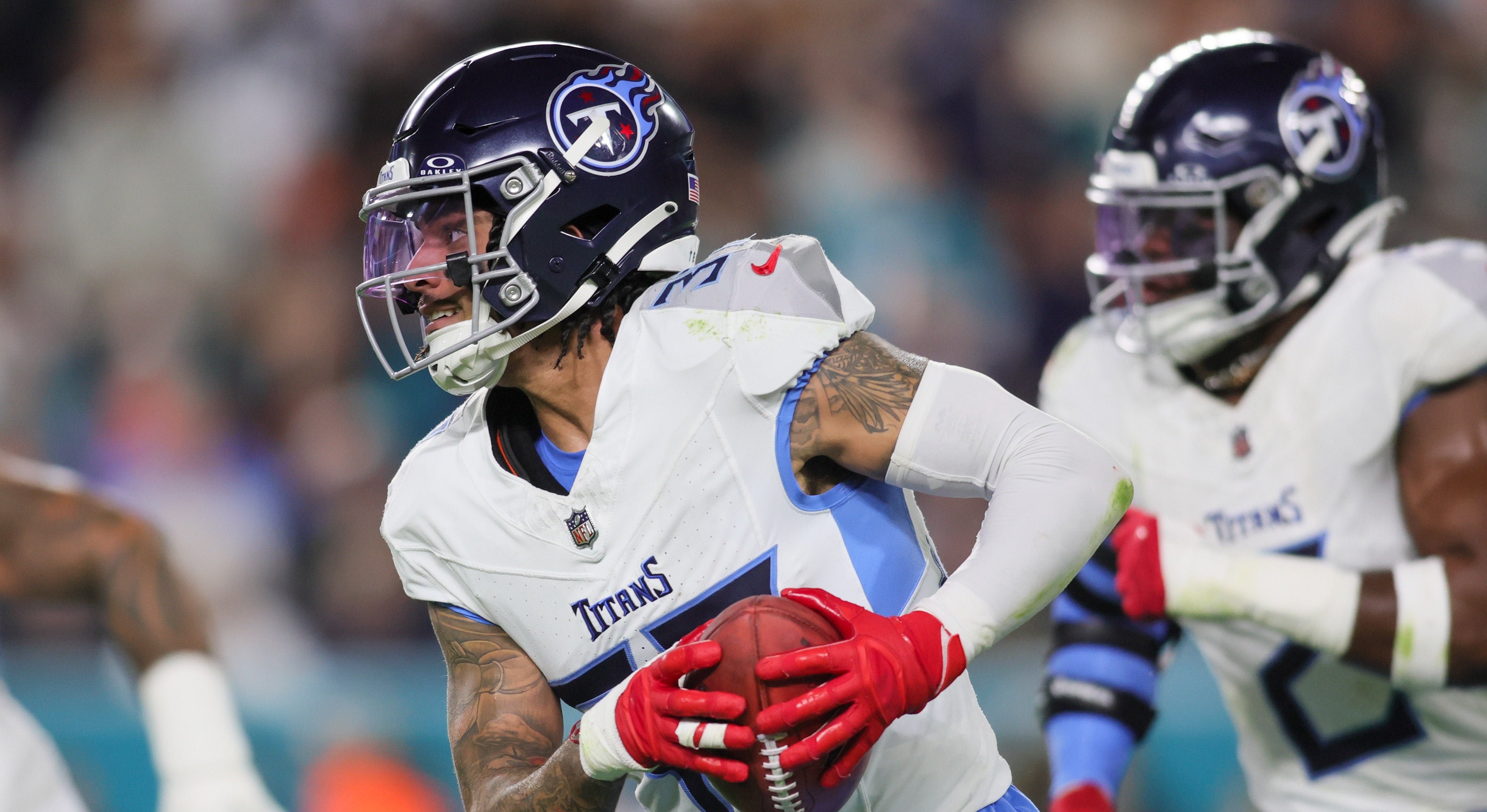 Tennessee Titans safety Amani Hooker (37) runs with the football after recovering a blocked kicked attempt against the Miami Dolphins during the second quarter at Hard Rock Stadium. Sam Navarro-USA TODAY Sports