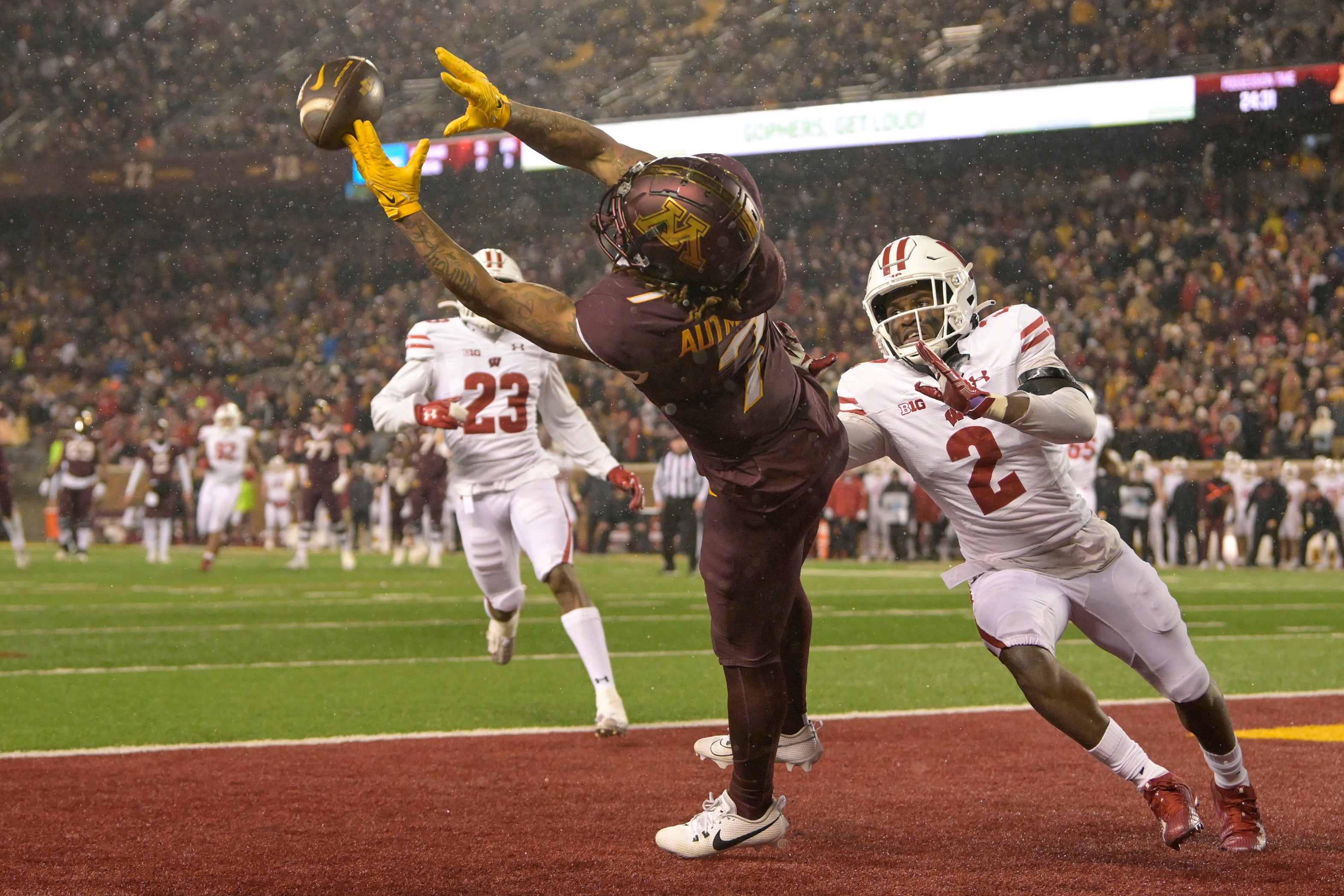 Nov 25, 2023; Minneapolis, Minnesota, USA; Minnesota Golden Gophers wide receiver Chris Autman-Bell (7) can t haul in this pass as Wisconsin Badgers defensive back Ricardo Hallman (2) defends during the fourth quarter at Huntington Bank Stadium.