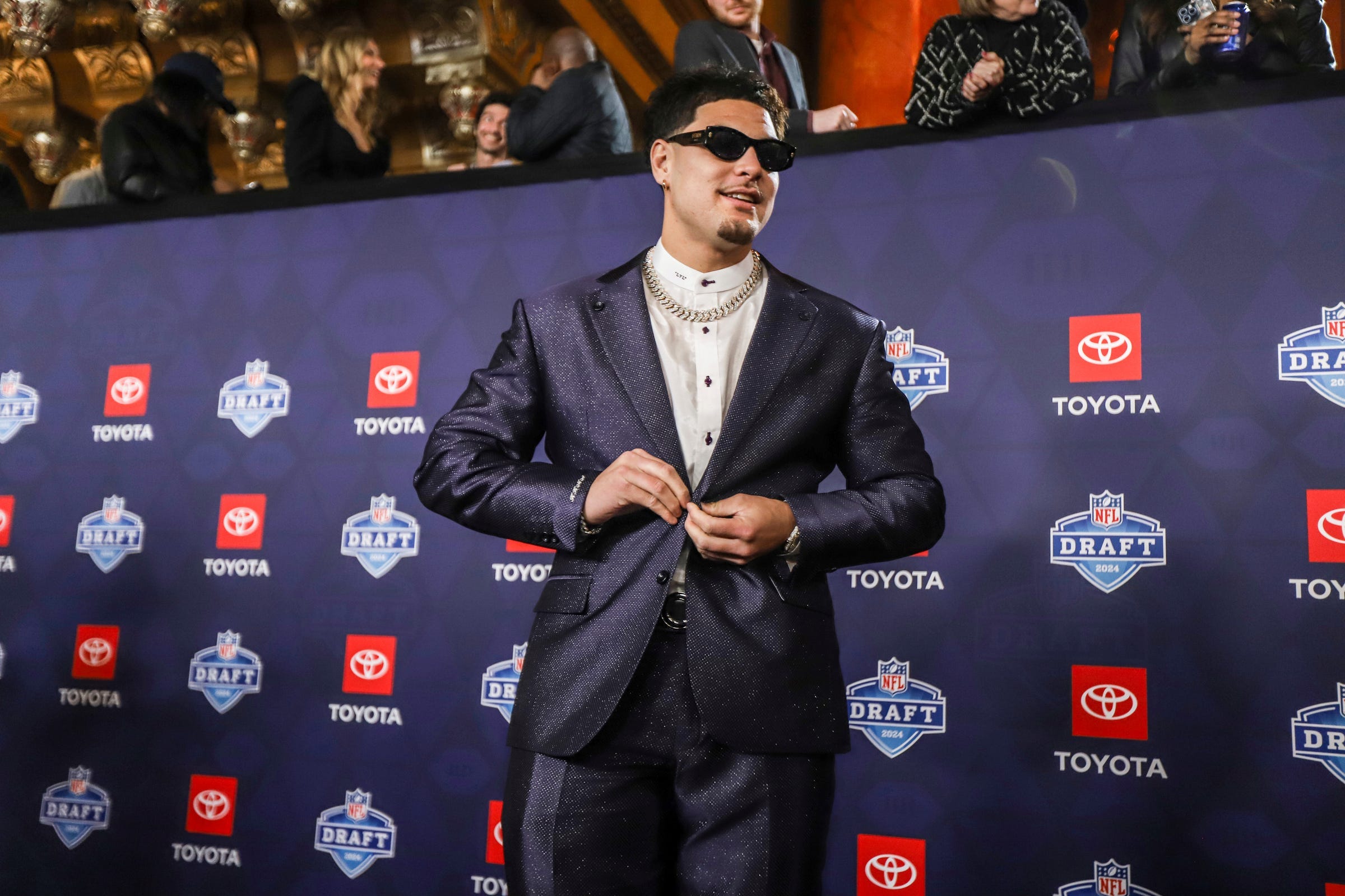 NFL Draft prospect Laiatu Latu walks the red carpet for NFL Draft day at the Fox Theatre in Detroit on Thursday, April 25, 2024.