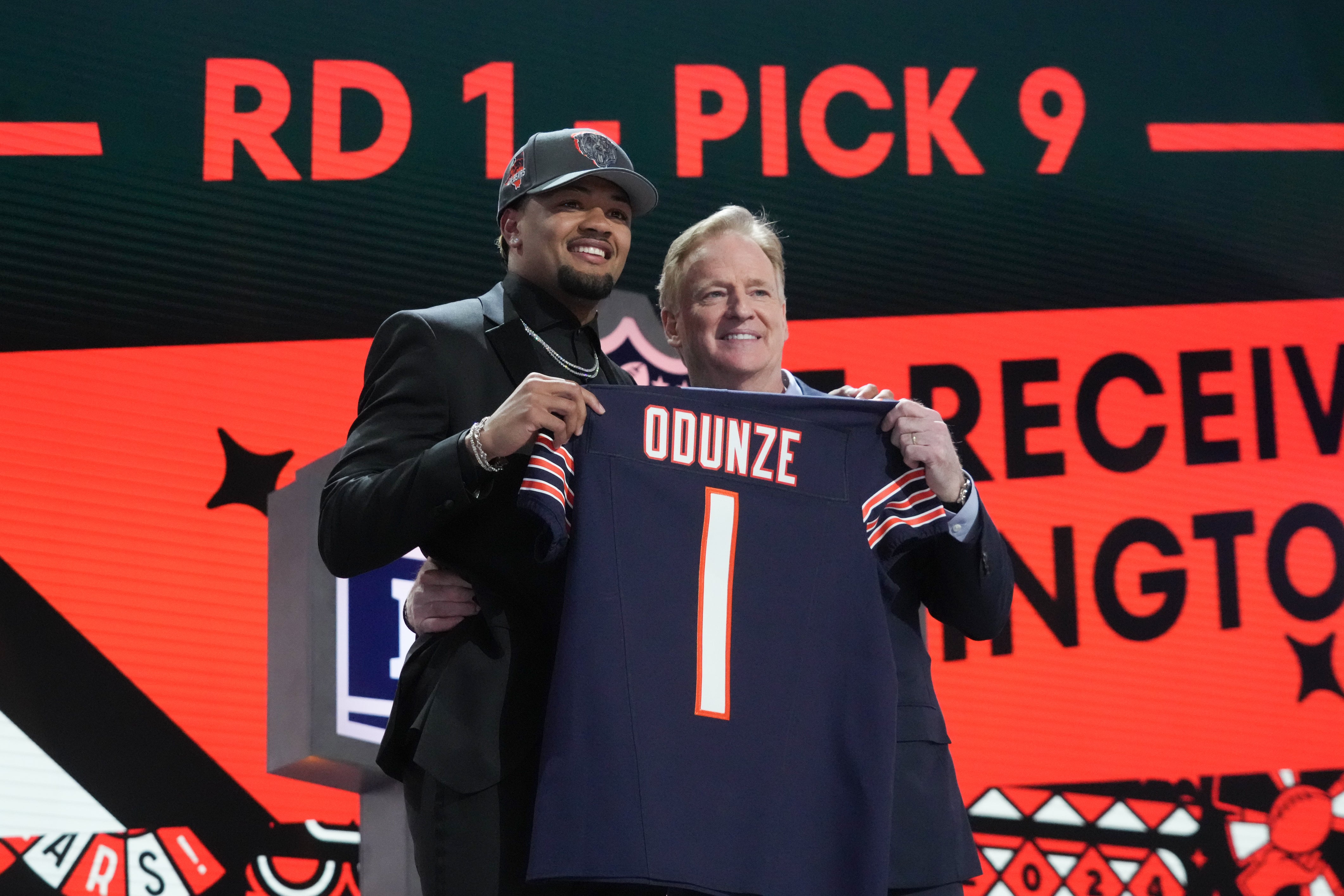Apr 25, 2024; Detroit, MI, USA; Washington Huskies wide receiver Rome Odunze poses with NFL commissioner Roger Goodell after being selected by the Chicago Bears as the No. 8 pick in the first round of the 2024 NFL Draft at Campus Martius Park and Hart Plaza.