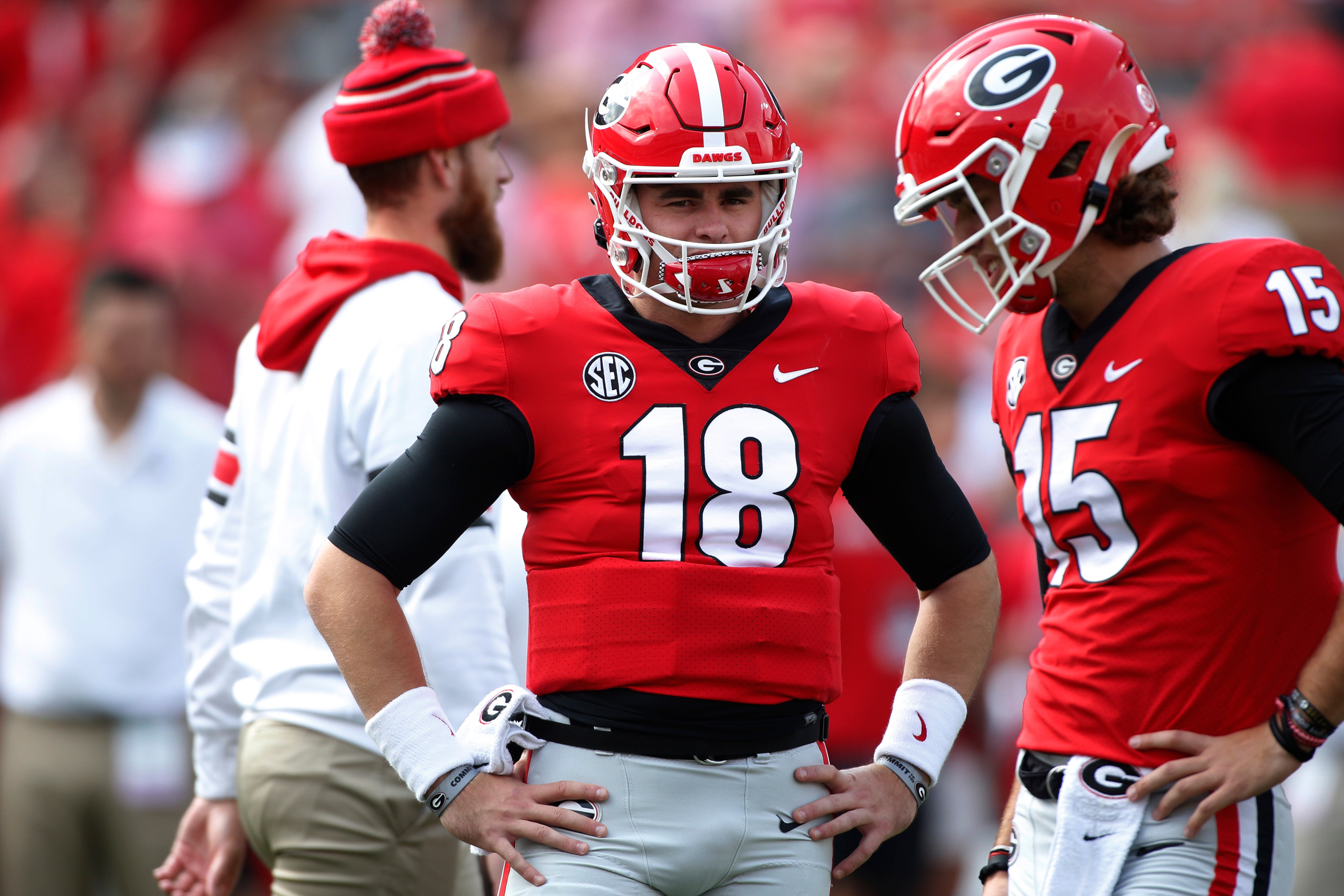 Oct 2, 2021; Athens, GA, USA; Georgia quarterback JT Daniels (18) and Georgia quarterback Carson Beck (15) look on during warm ups before an NCAA college football game between Arkansas and Georgia in Athens, Ga., on Saturday, Oct. 2, 2021.