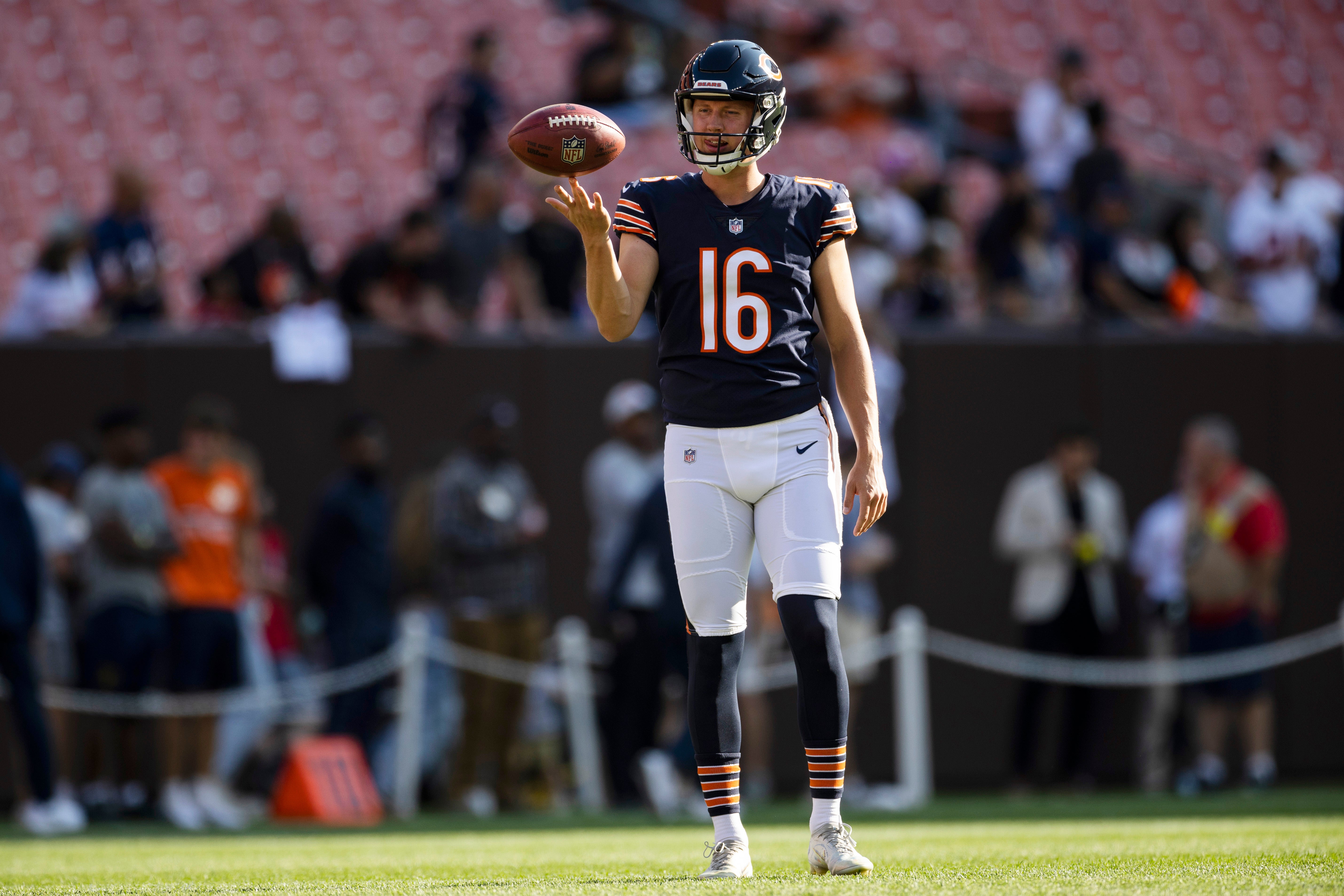 Aug 27, 2022; Cleveland, Ohio, USA; Chicago Bears punter Trenton Gill (16) spins the ball on his finger during warm ups before the game against the Cleveland Browns at FirstEnergy Stadium.