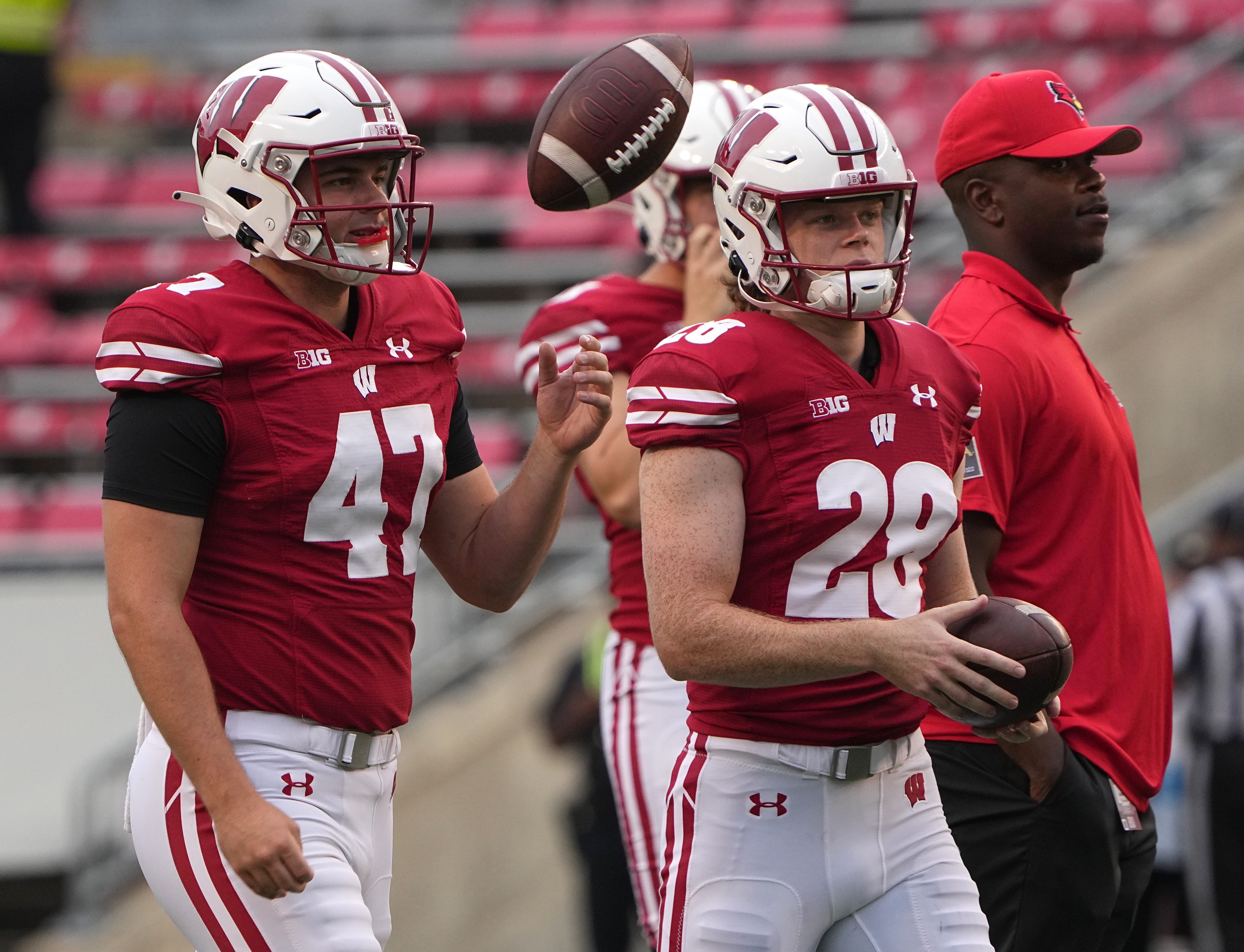 Wisconsin long snapper Peter Bowden (47) and punter Gavin Meyers (28)