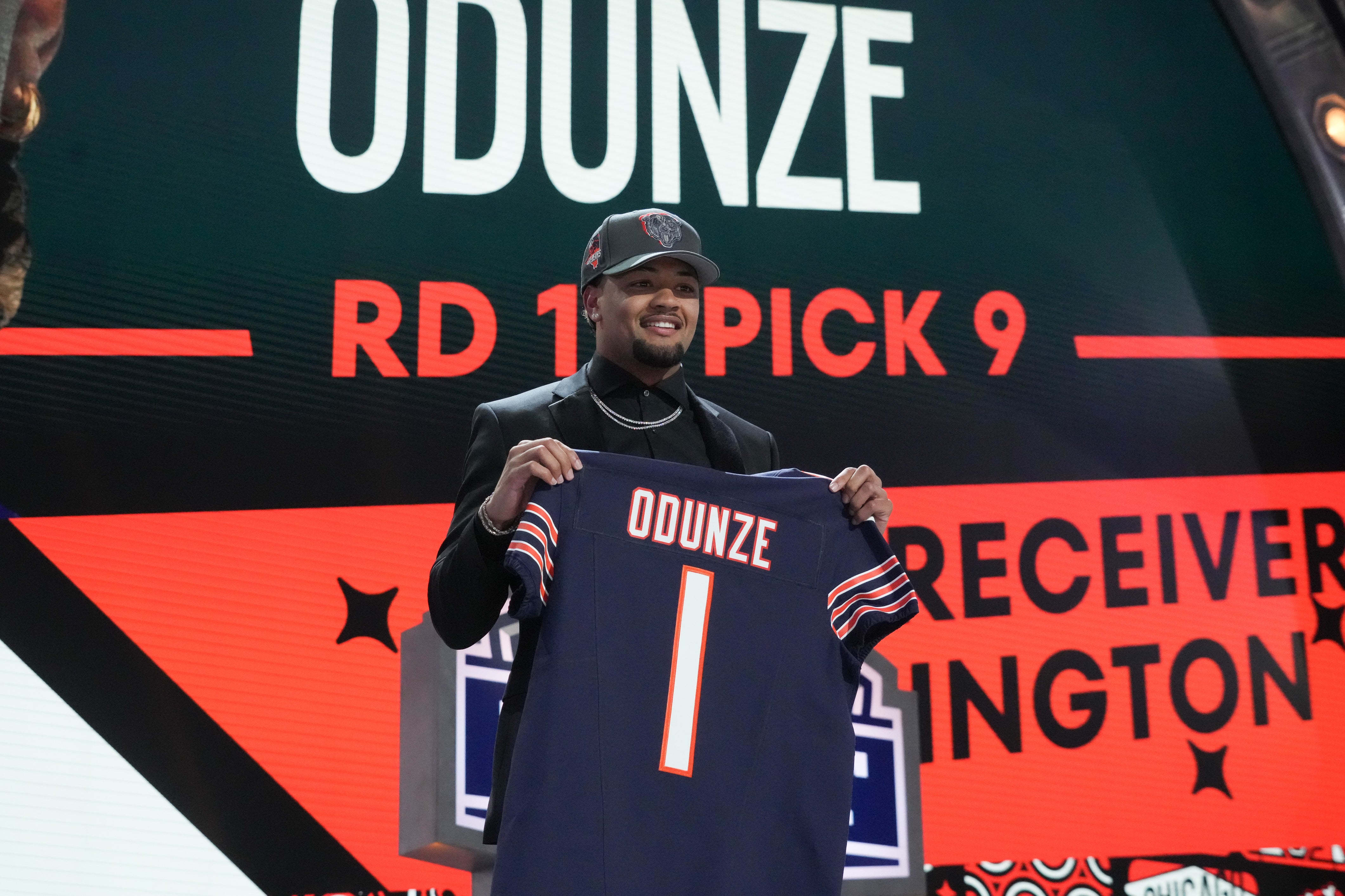 Washington Huskies wide receiver Rome Odunze poses after being selected by the Chicago Bears as the No. 8 pick in the first round of the 2024 NFL Draft at Campus Martius Park and Hart Plaza.