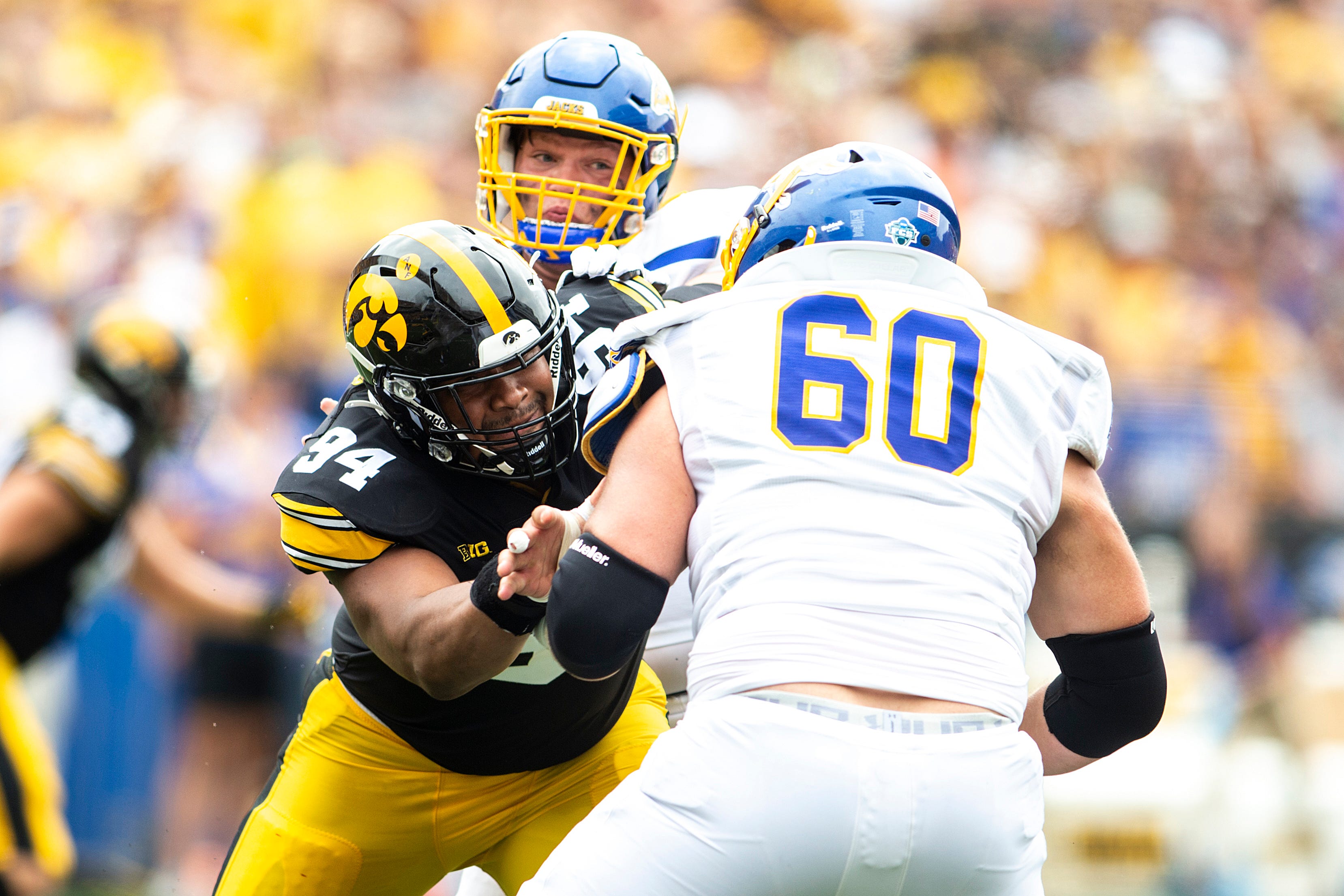 Iowa defensive lineman Yahya Black (94) blocks against South Dakota State offensive lineman Mason McCormick (60) during a NCAA football game, Saturday, Sept. 3, 2022, at Kinnick Stadium in Iowa City, Iowa. 220903 Sdsu Iowa Fb 030 Jpg  