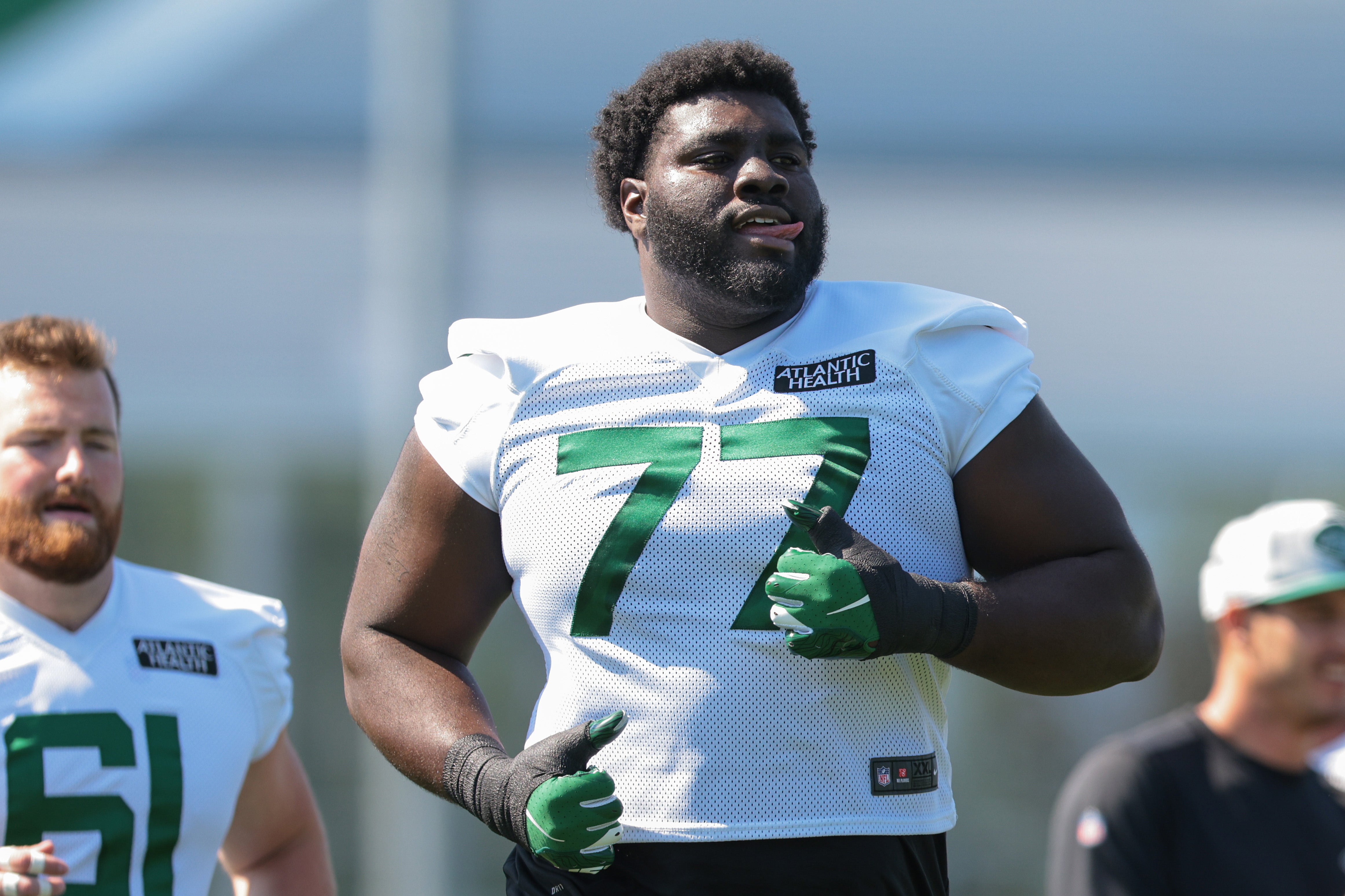 New York Jets offensive tackle Mekhi Becton (77) runs during training camp at Atlantic Health Jets Training Center.