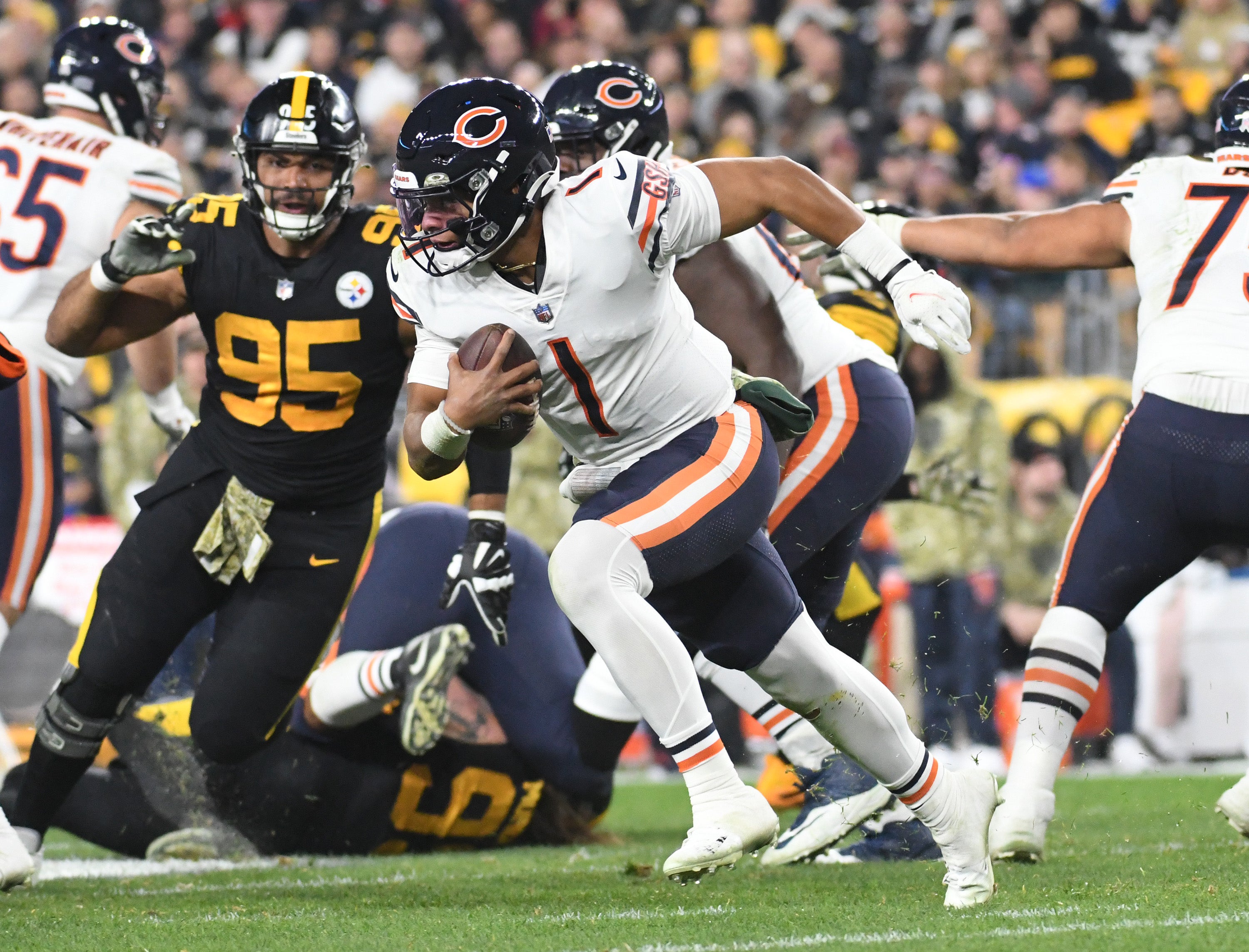 Nov 8, 2021; Pittsburgh, Pennsylvania, USA; Chicago Bears quarterback Justin Fields (1) scrambles for a second quarter run against the Pittsburgh Steelers at Heinz Field. Mandatory Credit: Philip G. Pavely-USA TODAY Sports