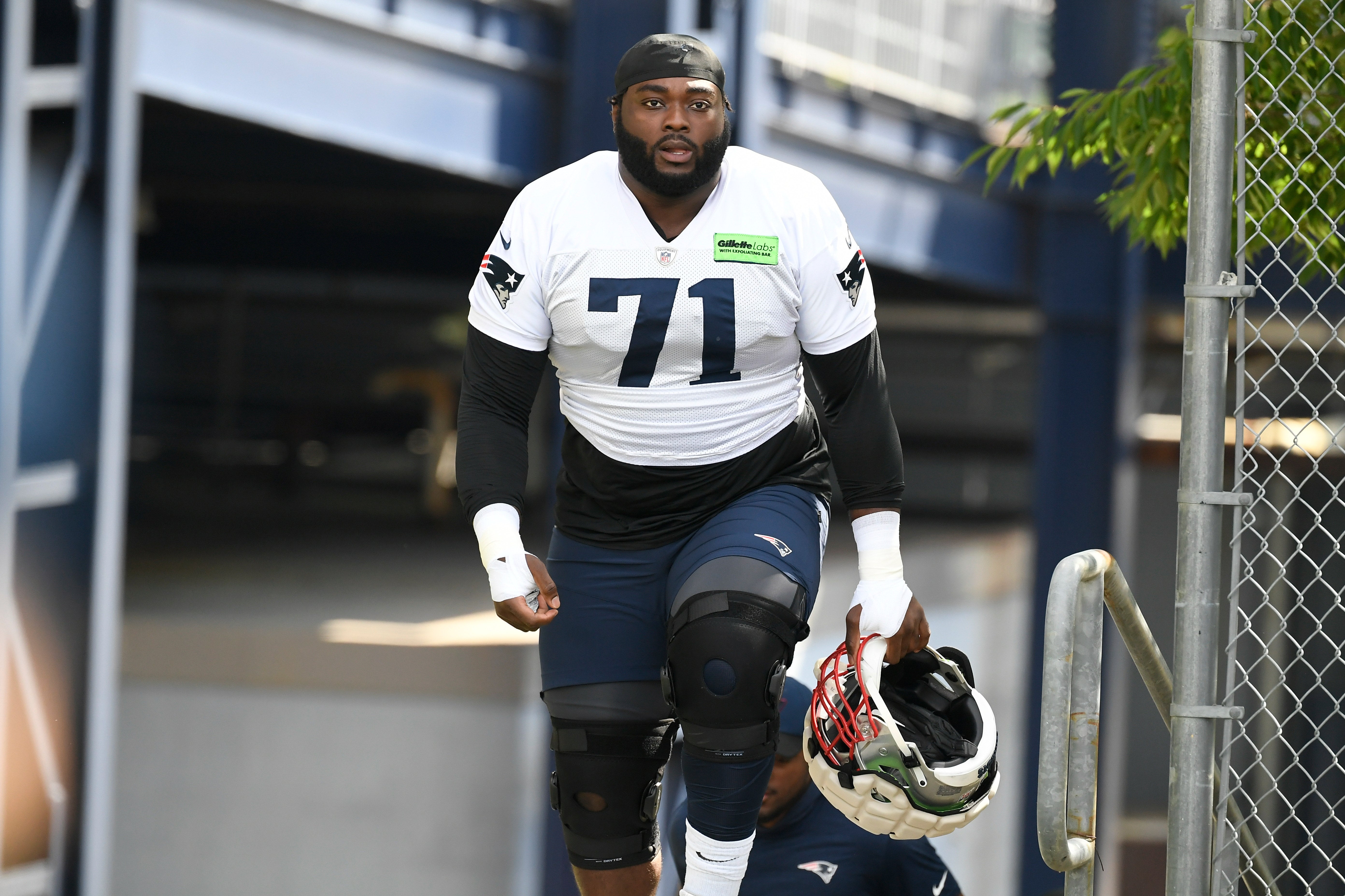 Jul 30, 2022; Foxborough, MA, USA; New England Patriots guard Mike Onwenu (71) walks to the practice field at the Patriots training camp at Gillette Stadium.