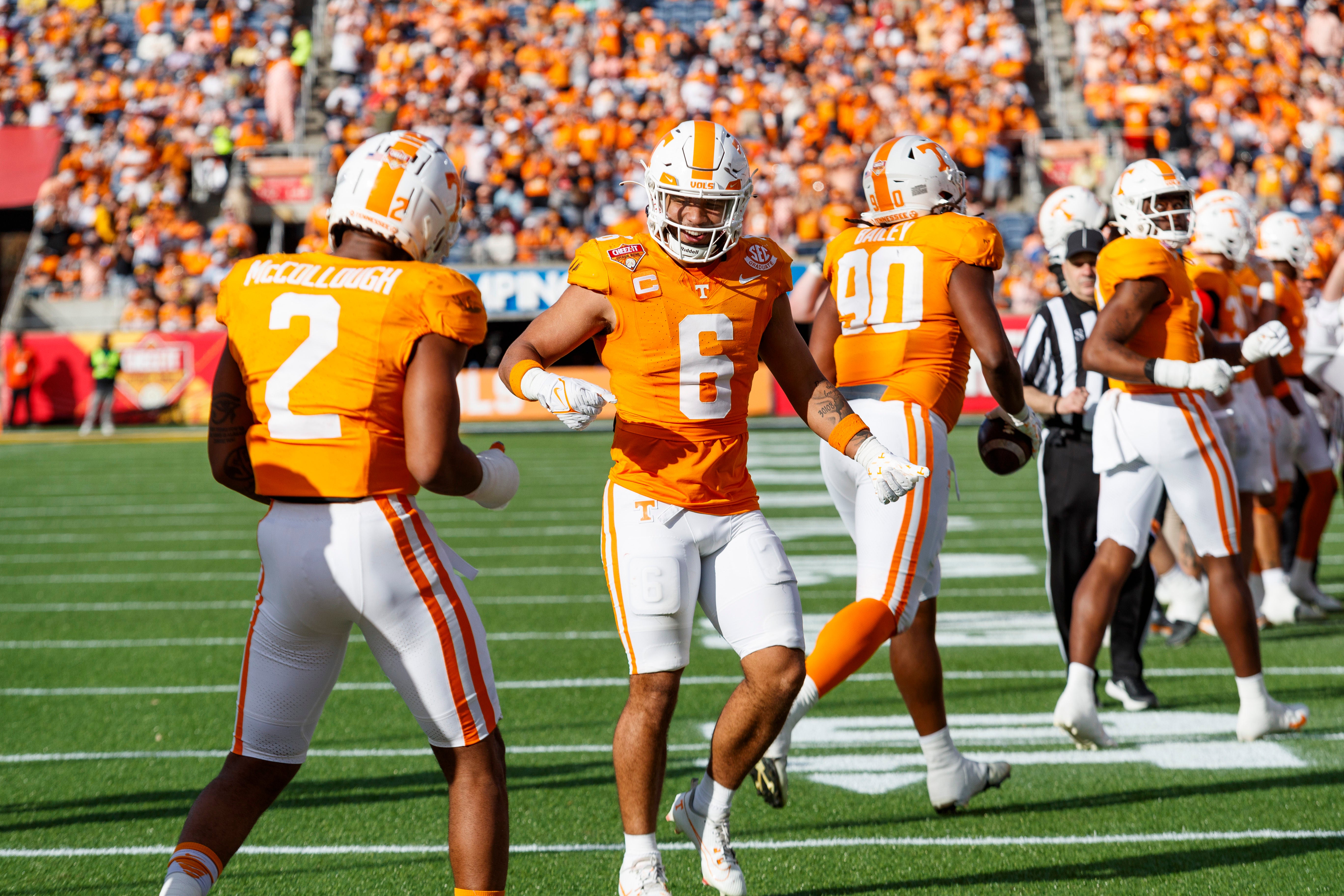 Jan 1, 2024; Orlando, FL, USA; Tennessee Volunteers linebacker Aaron Beasley (6) and defensive back Jaylen McCollough (2) react after a play against the Iowa Hawkeyes during the third quarter at Camping World Stadium.