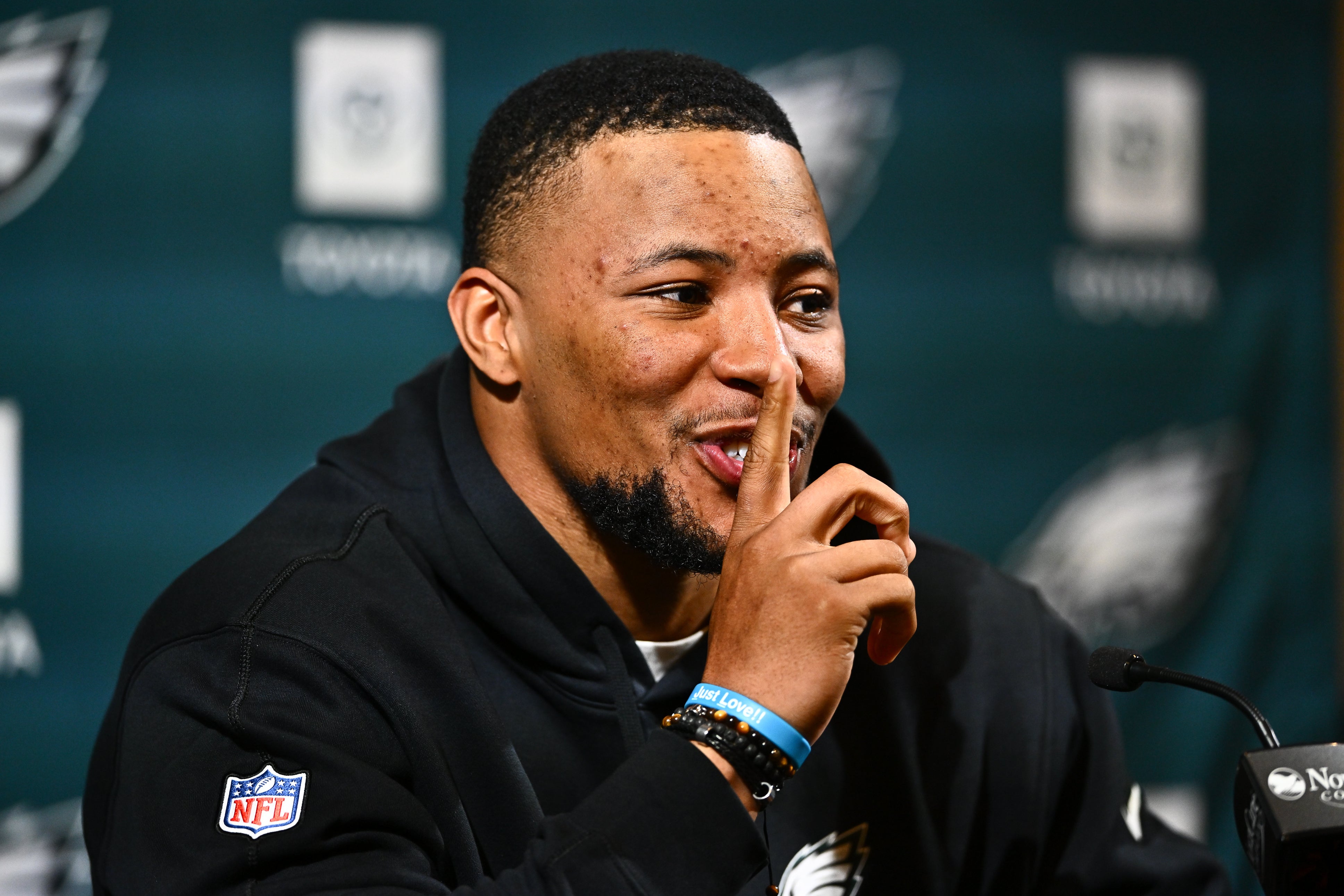 Philadelphia Eagles running back Saquon Barkley gestures during a press conference after signing with the team.