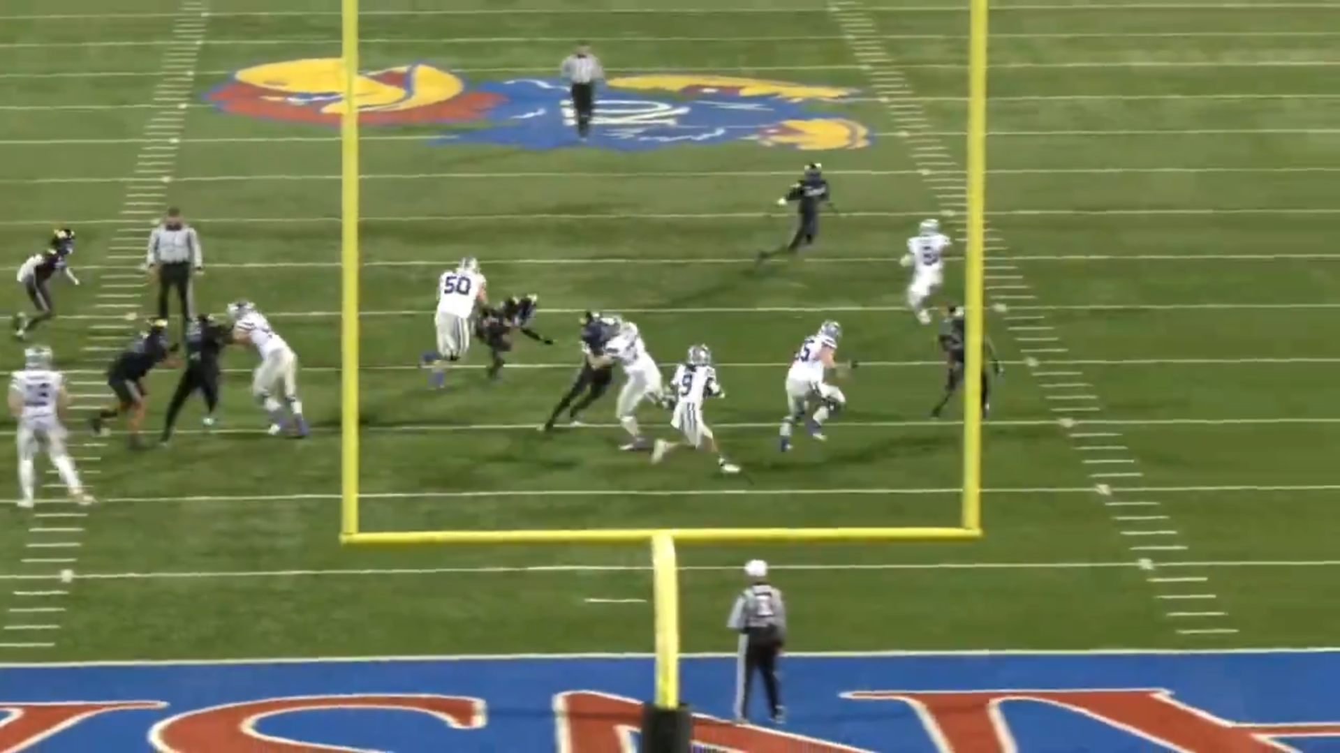 Cooper Beebe buries a linebacker against Kansas.