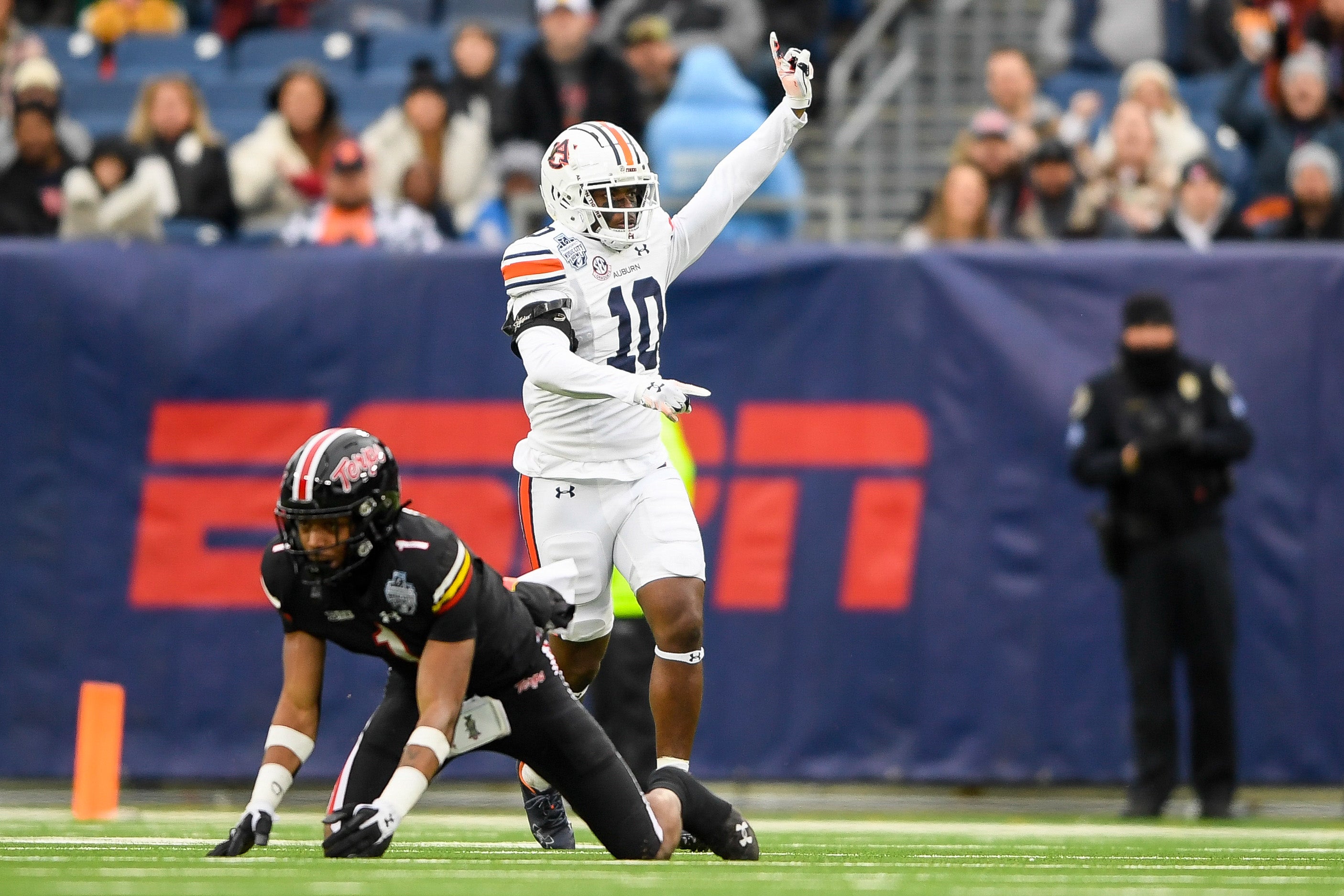 Dec 30, 2023; Nashville, TN, USA; Auburn Tigers safety Zion Puckett (10) celebrates the defensive play against the Maryland Terrapins during the first half at Nissan Stadium.