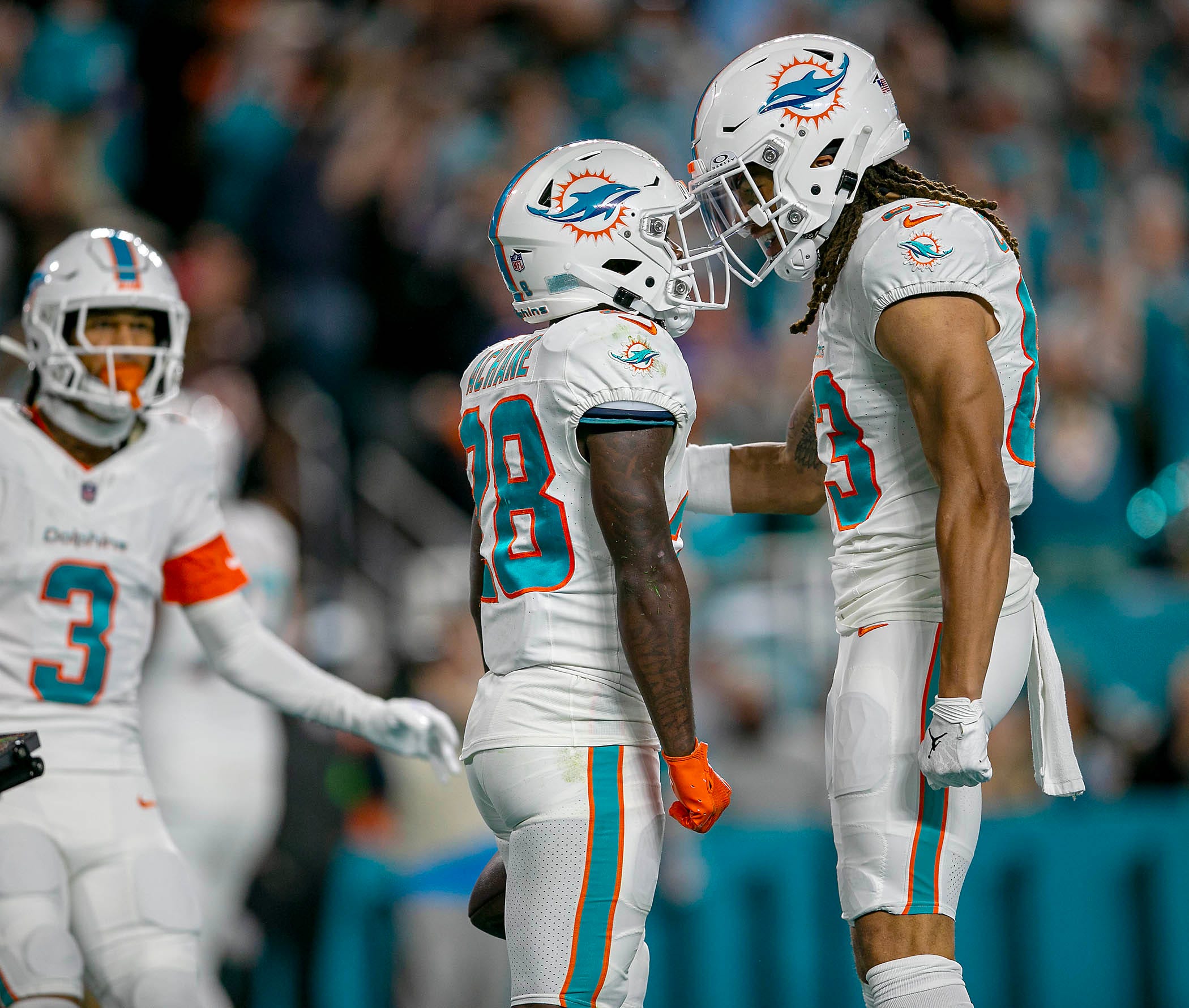 Miami Dolphins running back De'Von Achane (28), celebrates with teammate Miami Dolphins wide receiver Chase Claypool (83), after scoring a touch down agains the Buffalo Bills during NFL football game Jan 07, 2024, in Miami Gardens.