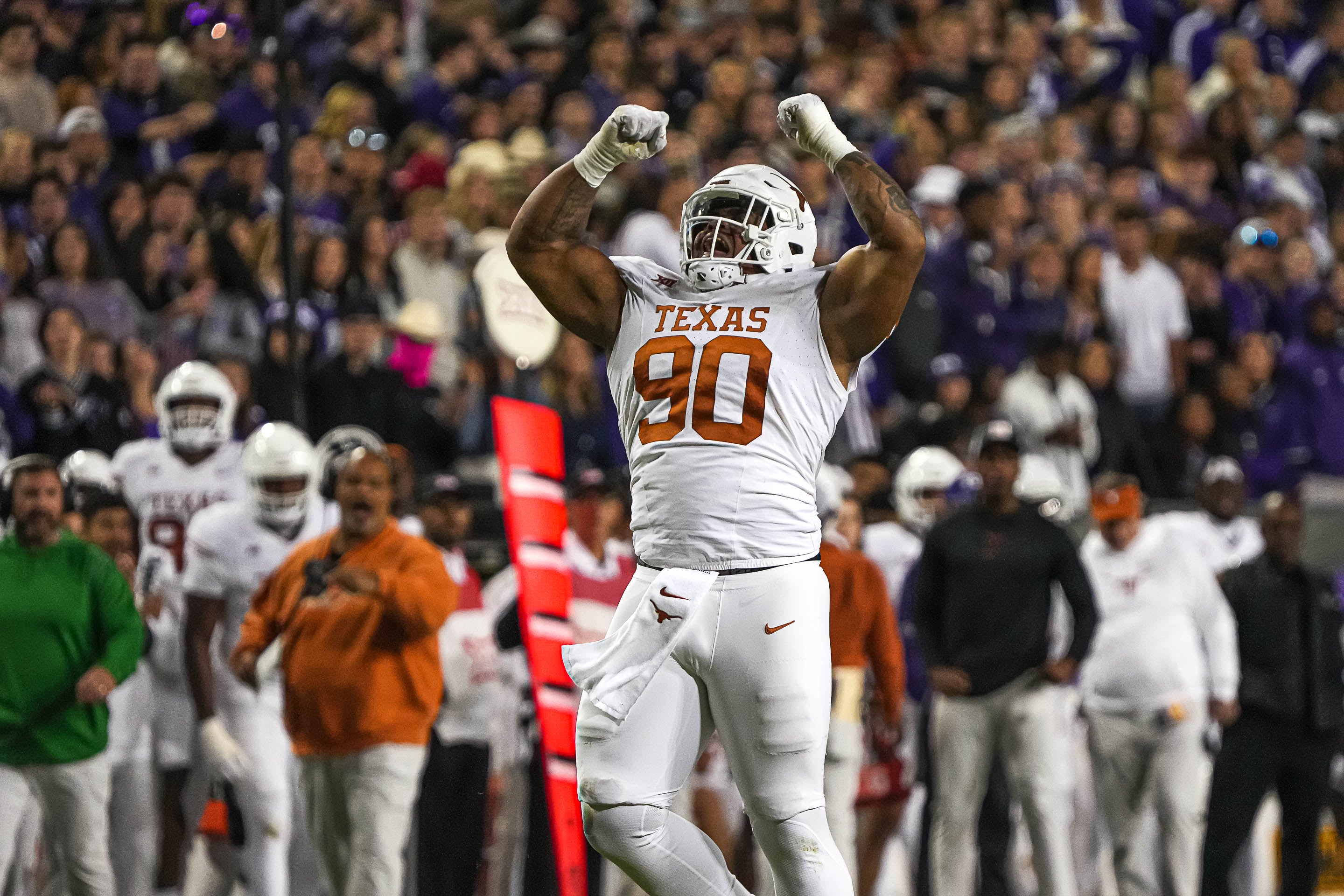 Nov 11, 2023; Fort Worth, Texas, USA; Texas Longhorns defensive lineman Byron Murphy II (90) celebrates a sack during the game against the TCU Horned Frogs at Amon G. Carter Stadium.