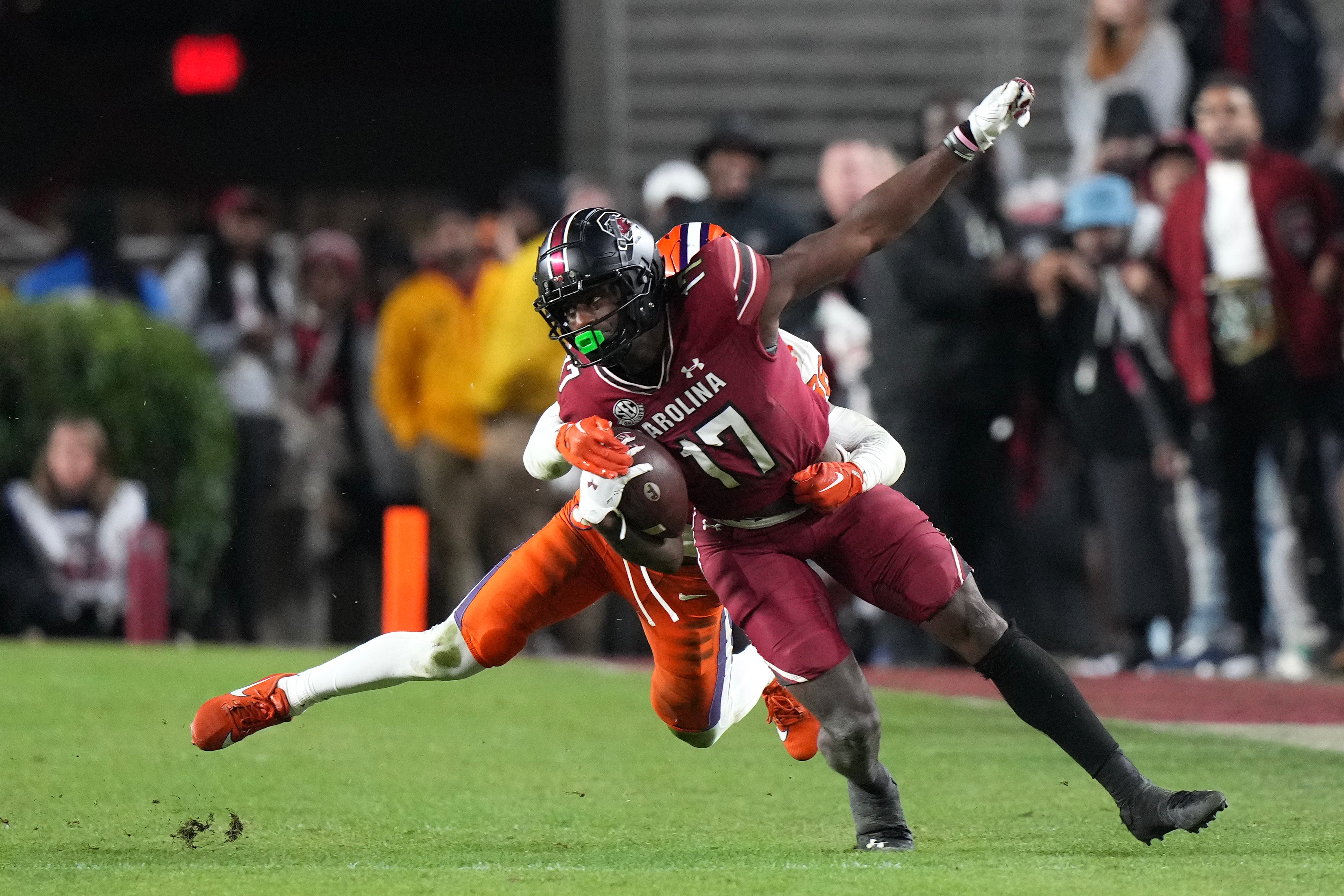 Nov 25, 2023; Columbia, South Carolina, USA; South Carolina Gamecocks wide receiver Xavier Legette (17) is tackled by Clemson Tigers safety Khalil Barnes (36) in the second half at Williams-Brice Stadium. Mandatory Credit: David Yeazell-USA TODAY Sports