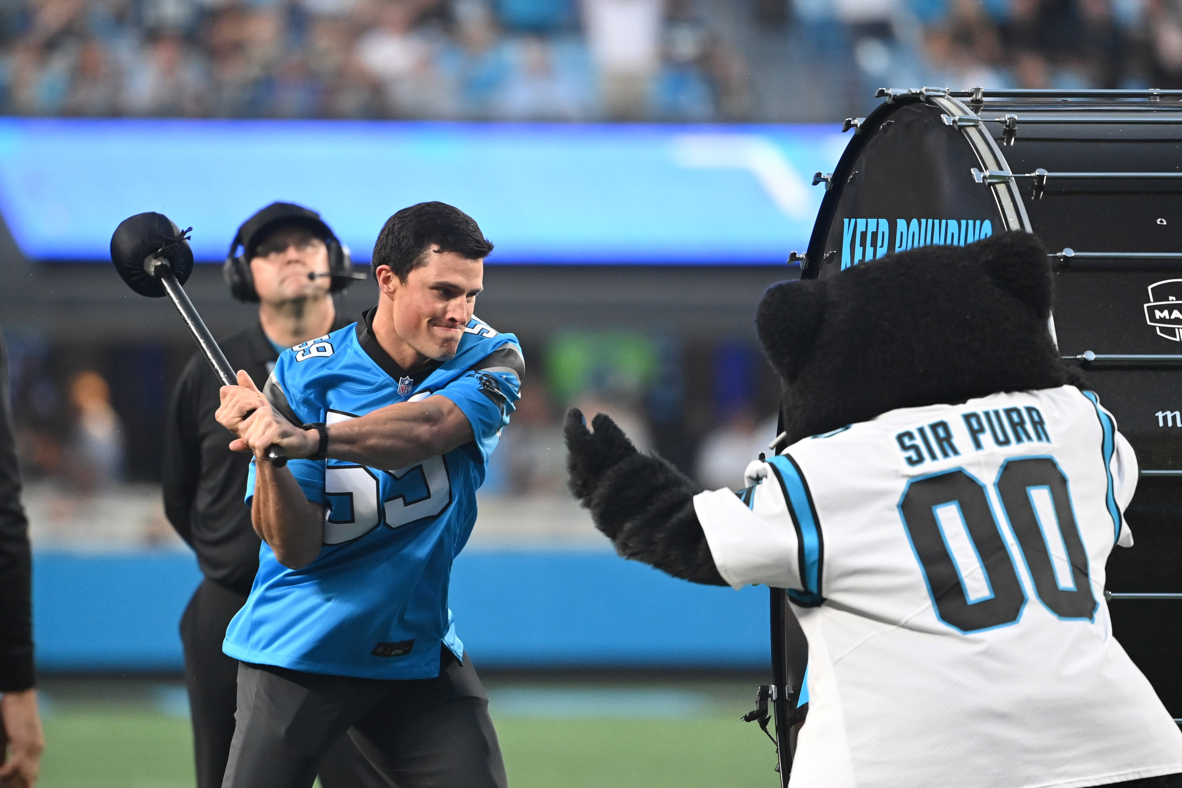 Sep 18, 2023; Charlotte, North Carolina, USA; Former Carolina Panthers great Luke Kuechly pounds the drum before the game at Bank of America Stadium. Mandatory Credit: Bob Donnan-USA TODAY Sports