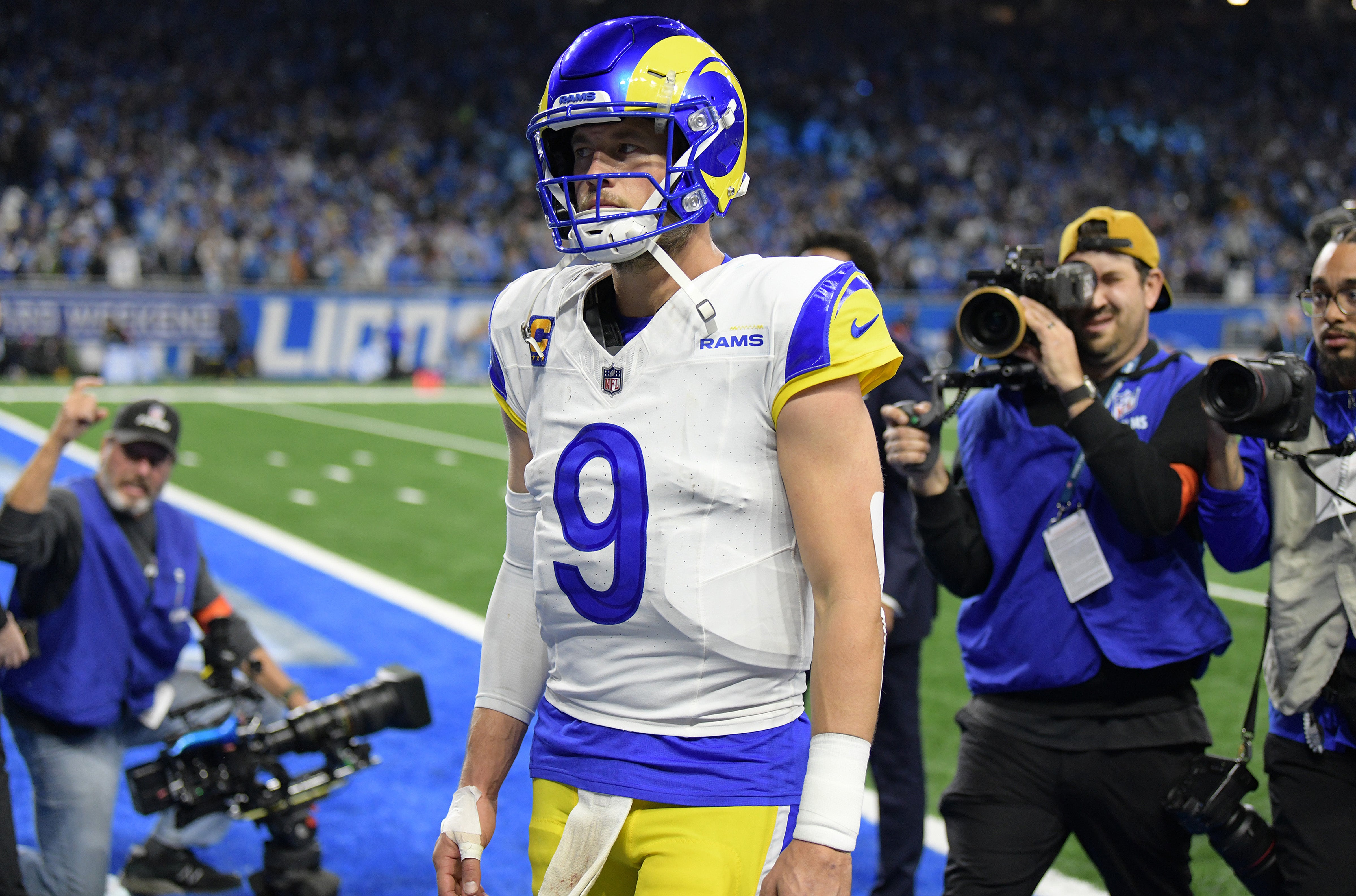 Jan 14, 2024; Detroit, Michigan, USA; Los Angeles Rams quarterback Matthew Stafford (9) walks off the field after losing a 2024 NFC wild card game against the Detroit Lions at Ford Field. Mandatory Credit: Lon Horwedel-USA TODAY Sports