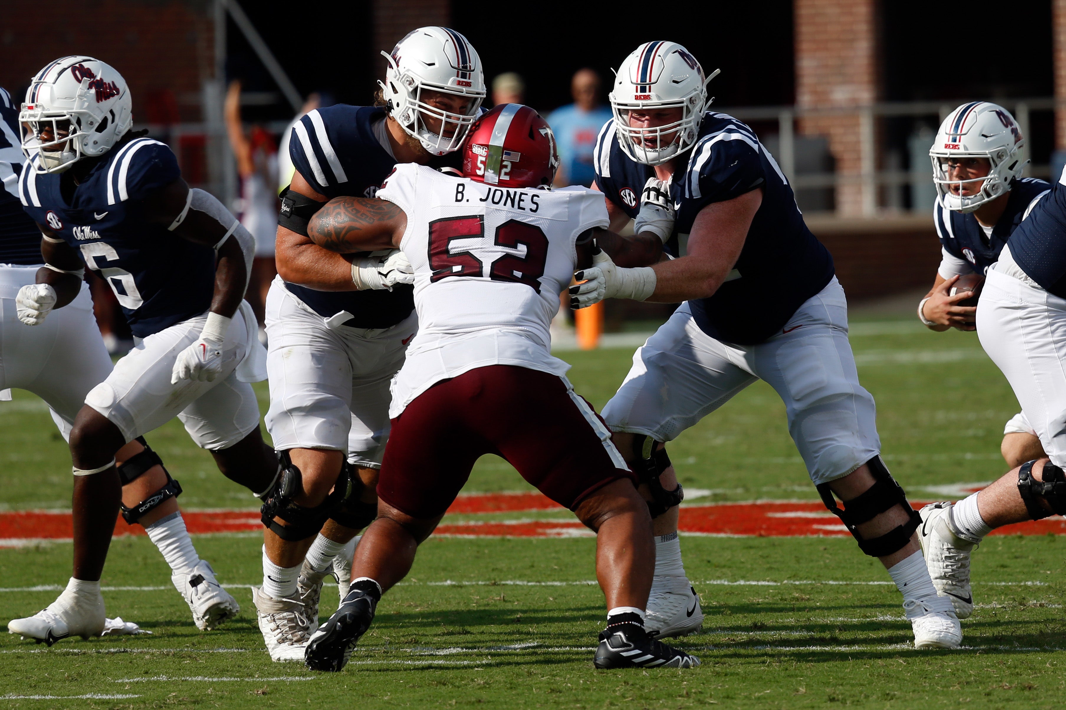 Sep 3, 2022; Oxford, Mississippi, USA; Mississippi Rebels offensive linemen Eli Acker (left) and Mississippi Rebels offensive linemen Caleb Warren (right) block Troy Trojans defensive tackle Buddha Jones (52) during the first half at Vaught-Hemingway Stadium.