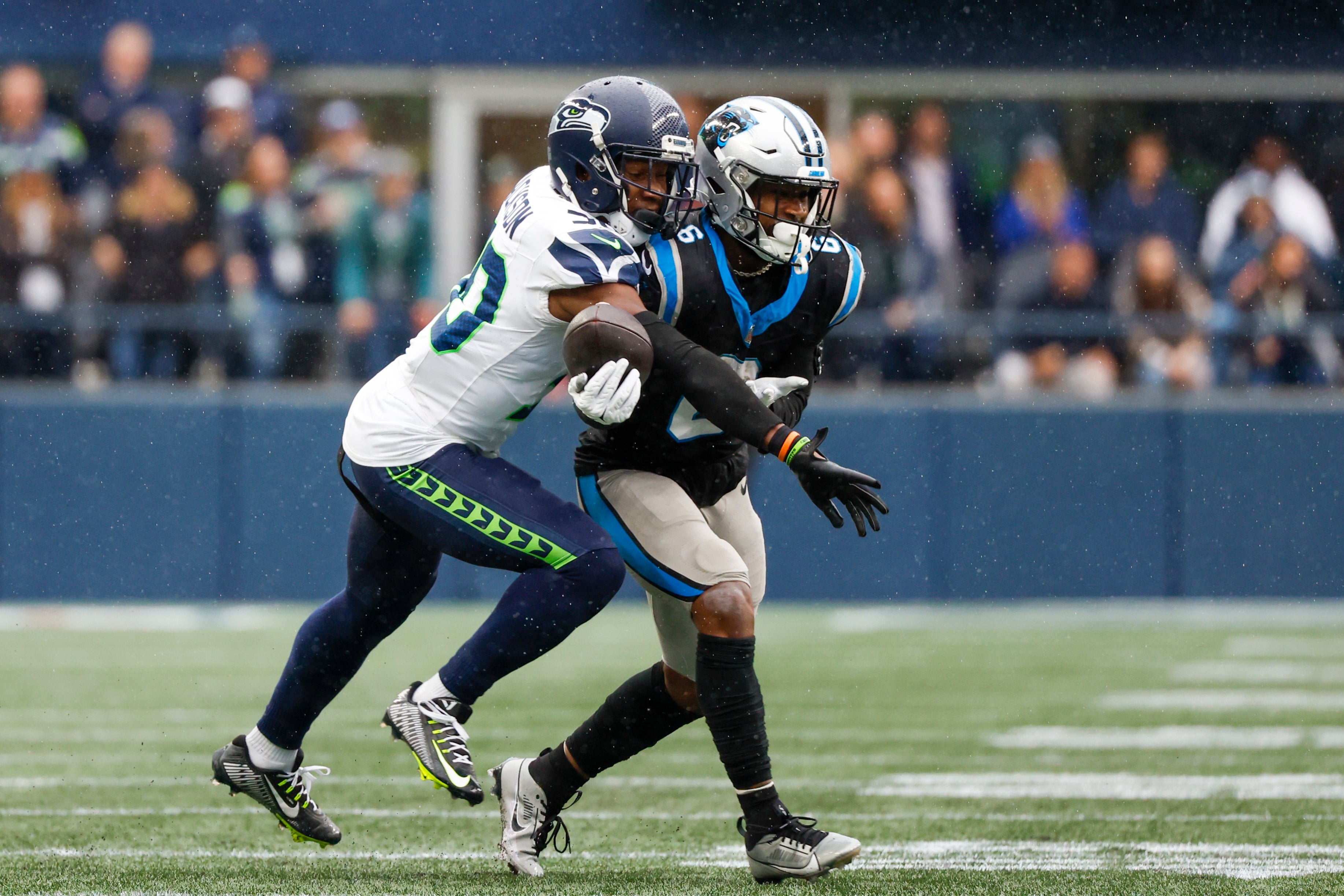 Sep 24, 2023; Seattle, Washington, USA; Seattle Seahawks cornerback Michael Jackson (30) breaks a up a pass intended for Carolina Panthers running back Miles Sanders (6) during the fourth quarter at Lumen Field.