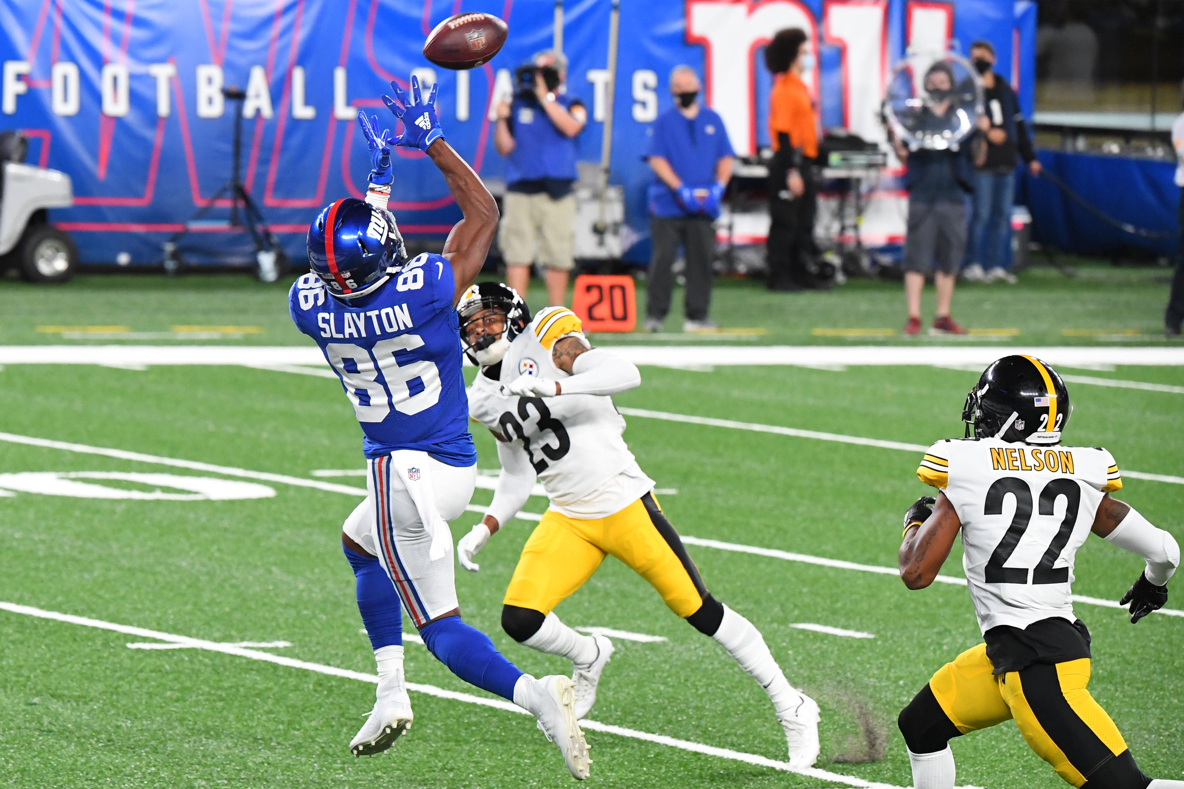 Sep 14, 2020; East Rutherford, New Jersey, USA; New York Giants wide receiver Darius Slayton (86) catches a ball for a touchdown past Pittsburgh Steelers cornerback Joe Haden (23) during the second quarter at MetLife Stadium. Mandatory Credit: Robert Deutsch-USA TODAY Sports  