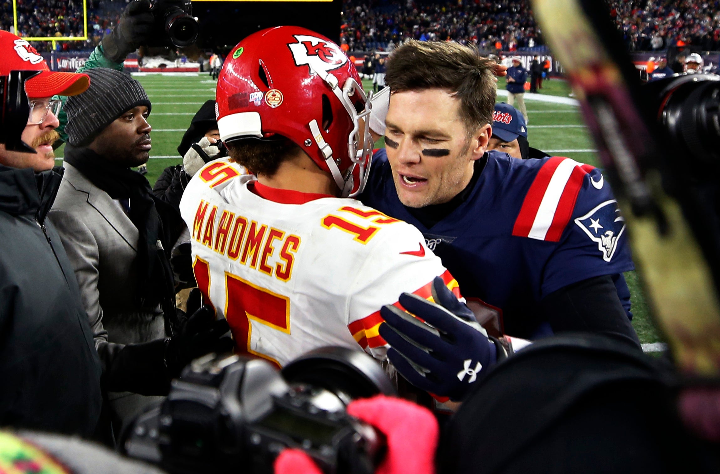 Dec 8, 2019; Foxborough, MA, USA; New England Patriots quarterback Tom Brady (12) congratulates Kansas City Chiefs quarterback Patrick Mahomes (15) after their game at Gillette Stadium.