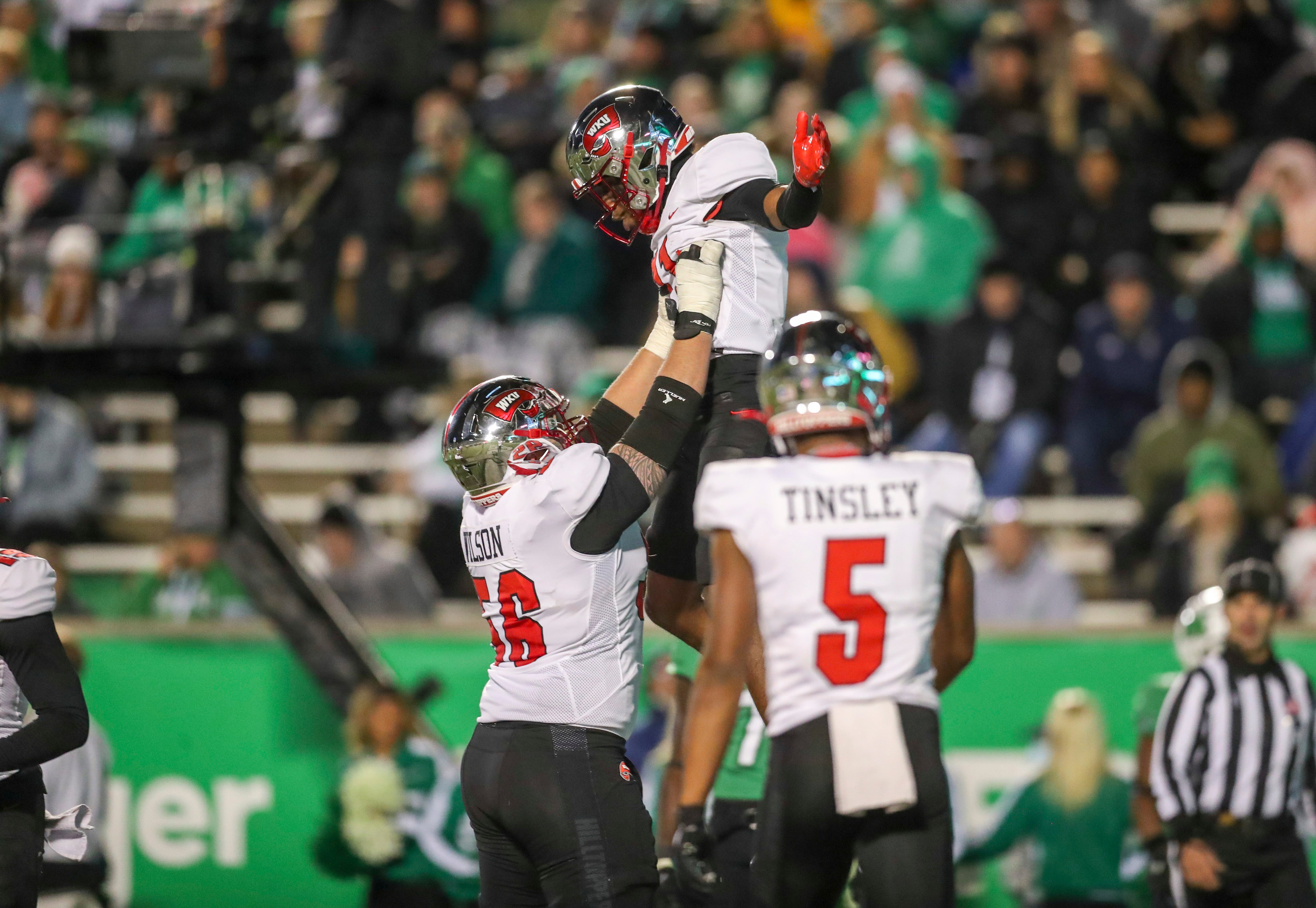 Nov 27, 2021; Huntington, West Virginia, USA; Western Kentucky Hilltoppers wide receiver Malachi Corley (11) celebrates with teammates after catching a pass for a touchdown against the Marshall Thundering Herd during the third quarter at Joan C. Edwards Stadium.