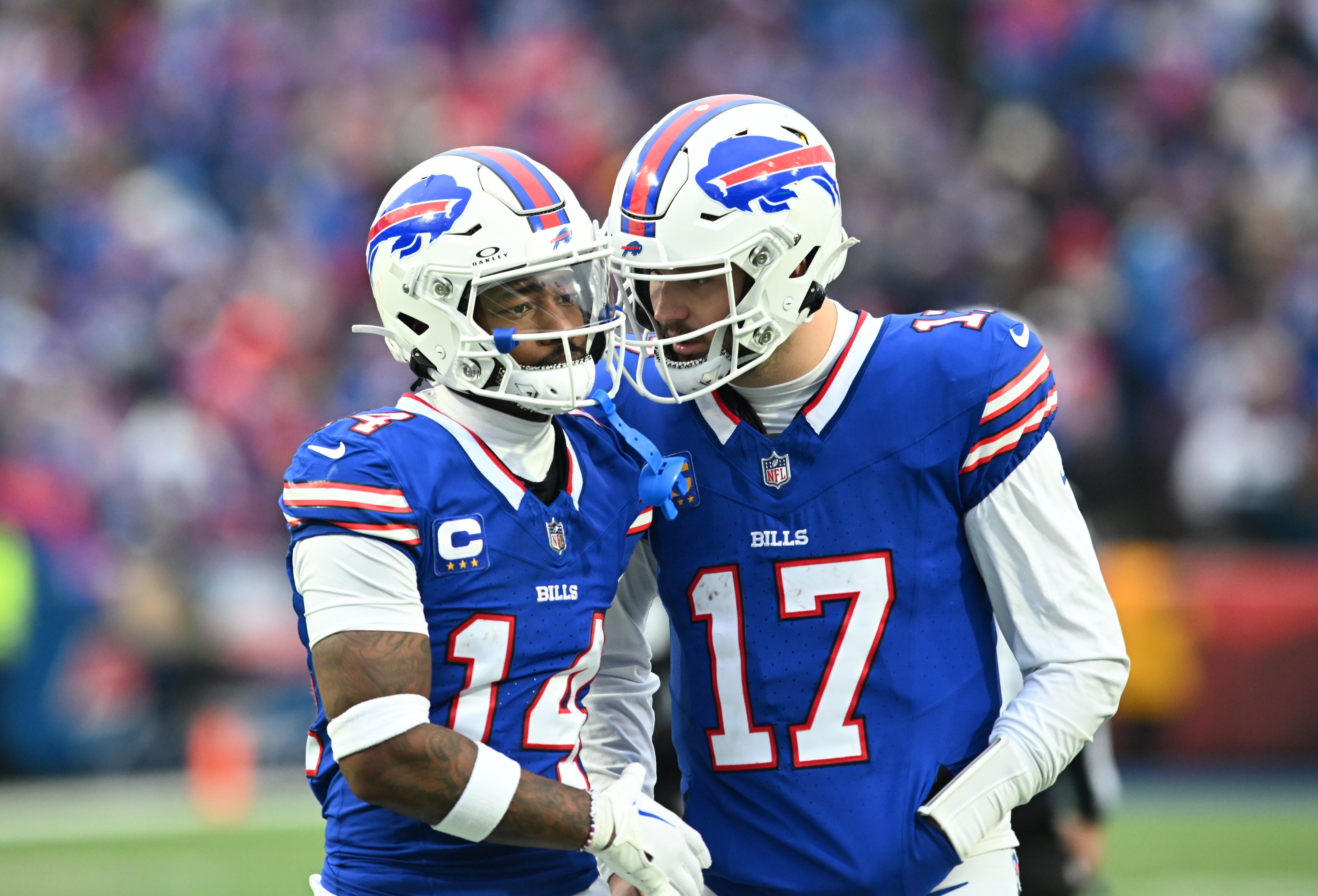 Dec 31, 2023; Orchard Park, New York, USA; Buffalo Bills quarterback Josh Allen (17) has a word with wide receiver Stefon Diggs (14) between plays in the third quarter game against the New England Patriots at Highmark Stadium.