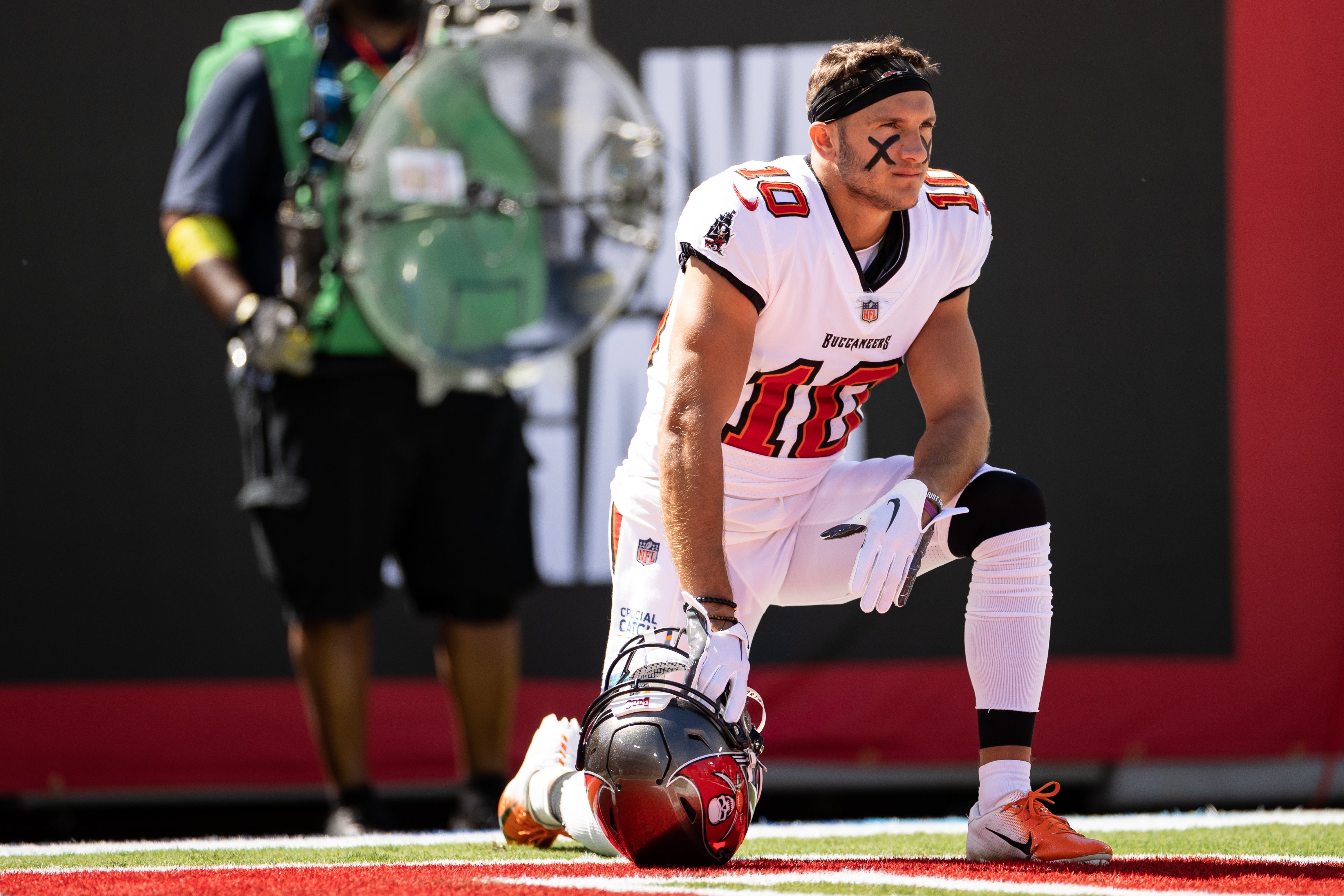 Oct 9, 2022; Tampa, Florida, USA; Tampa Bay Buccaneers wide receiver Scotty Miller (10) takes a knee before the game against the Atlanta Falcons at Raymond James Stadium. Mandatory Credit: Matt Pendleton-USA TODAY Sports
