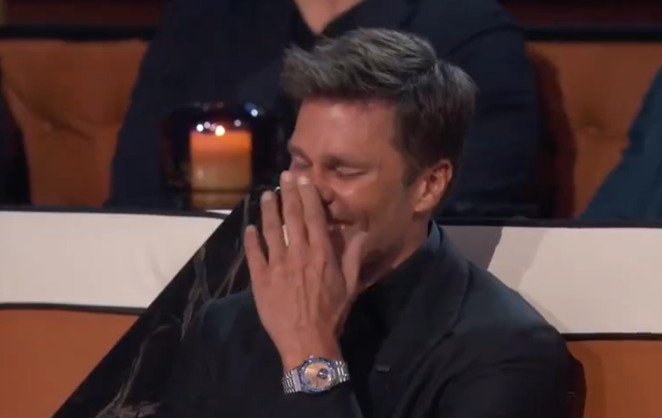 Tom Brady laughs at a joke made during Netflix's The Greatest Roast of All Time.