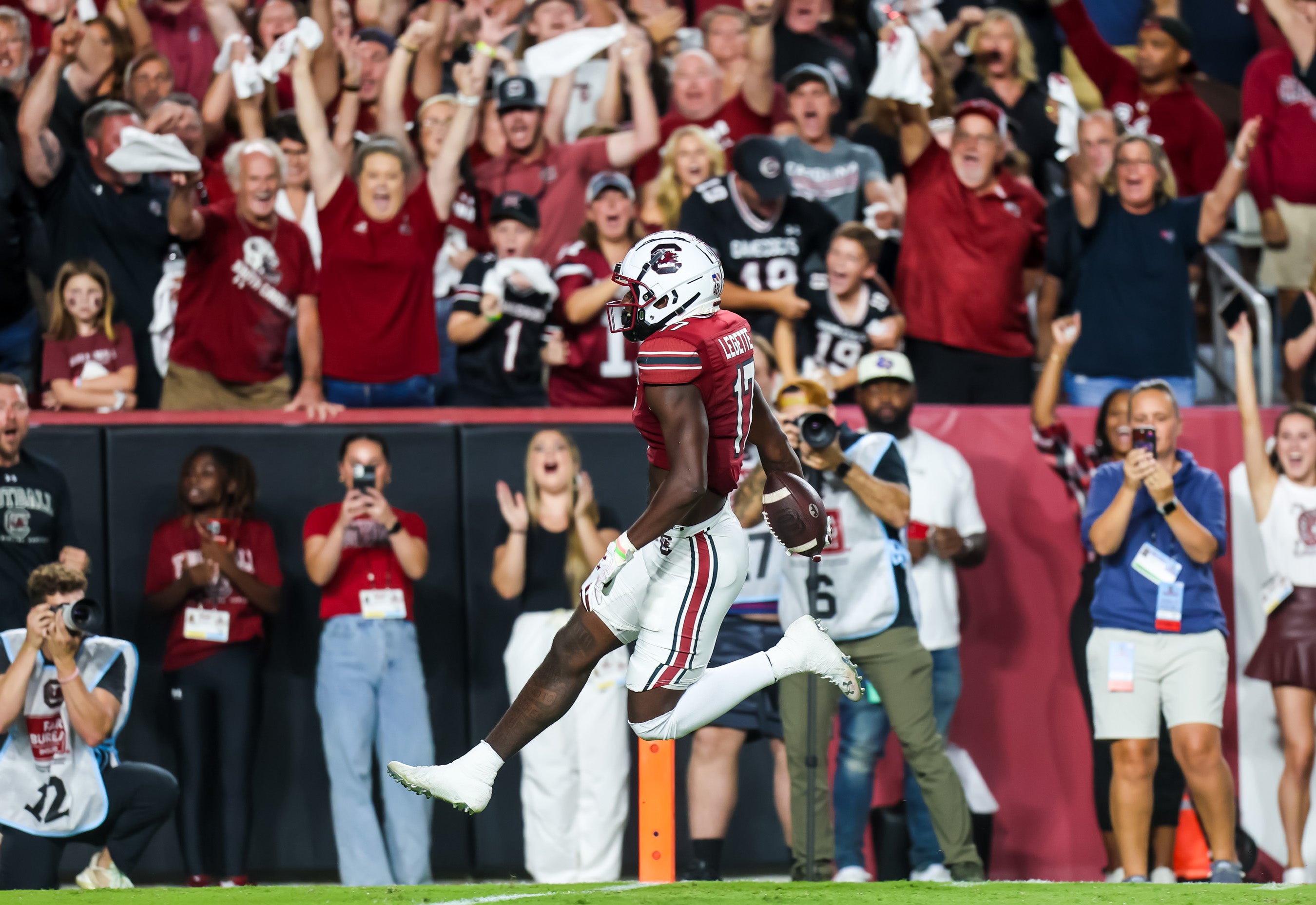 Sep 23, 2023; Columbia, South Carolina, USA; South Carolina Gamecocks wide receiver Xavier Legette (17) scores on a 76-yard touchdown reception against the Mississippi State Bulldogs in the first half at Williams-Brice Stadium. Mandatory Credit: Jeff Blake-USA TODAY Sports