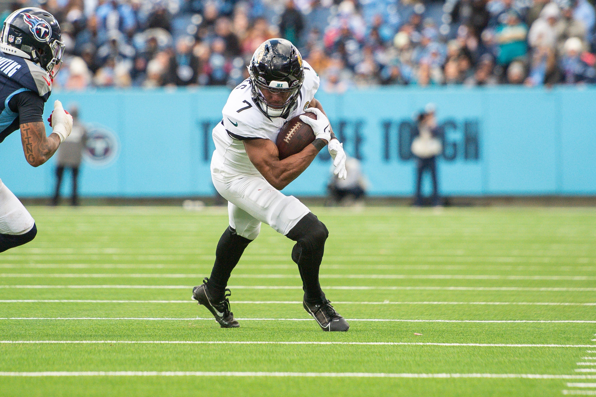 Jacksonville Jaguars wide receiver Zay Jones (7) runs the ball against the Tennessee Titans during the second half at Nissan Stadium.