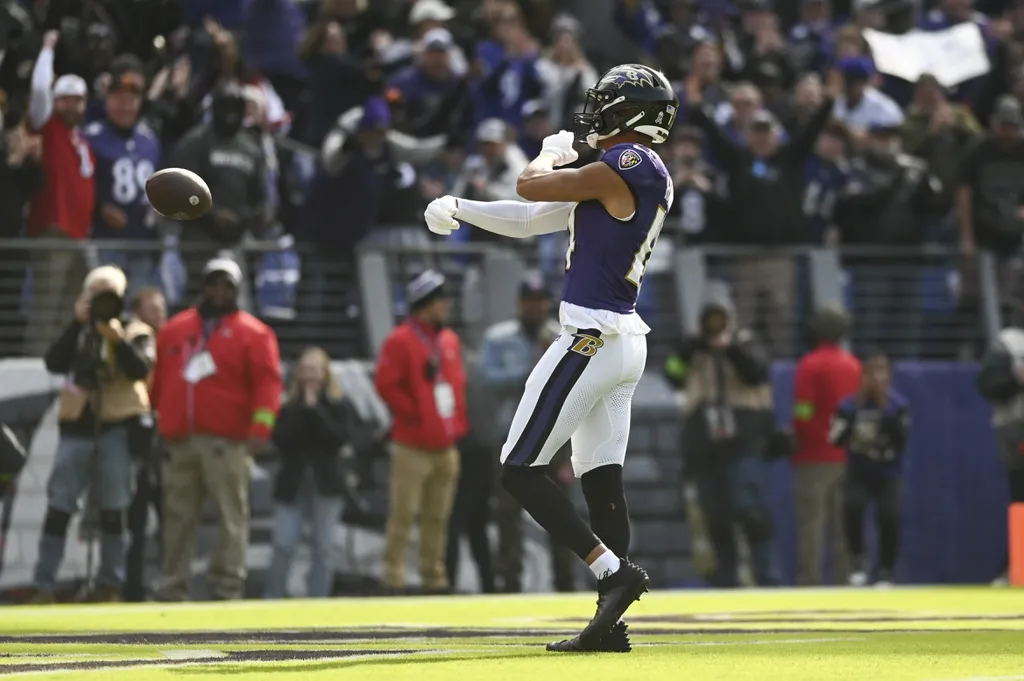 Baltimore Ravens safety Kyle Hamilton (14) celebrates after returning a interception for a first quarter touchdown against the Cleveland Browns at M&T Bank Stadium.