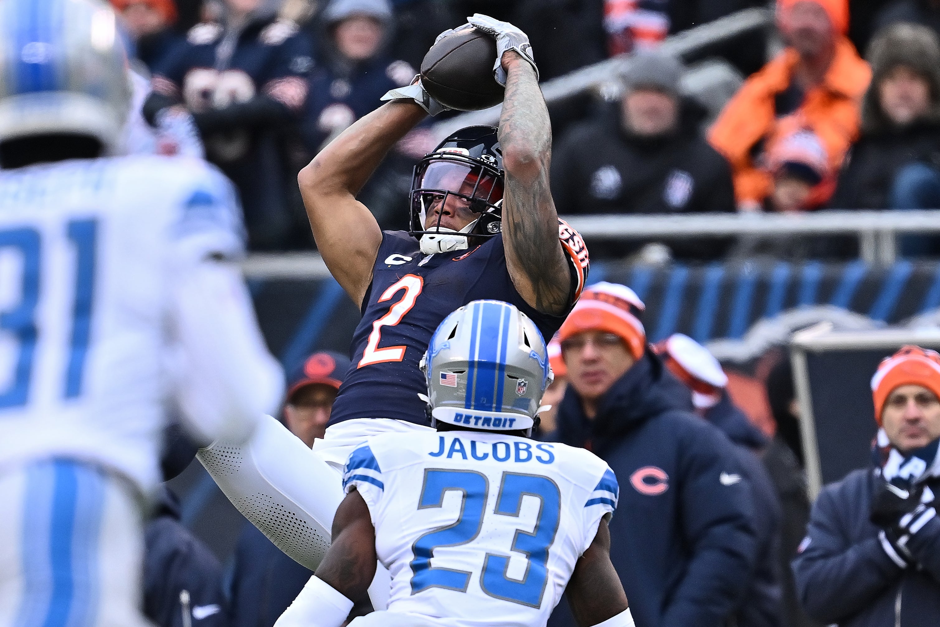 Dec 10, 2023; Chicago, Illinois, USA; Chicago Bears wide receiver DJ Moore (2) makes a catch for a first down over Detroit Lions cornerback Jerry Jacobs (23) in the second half at Soldier Field.