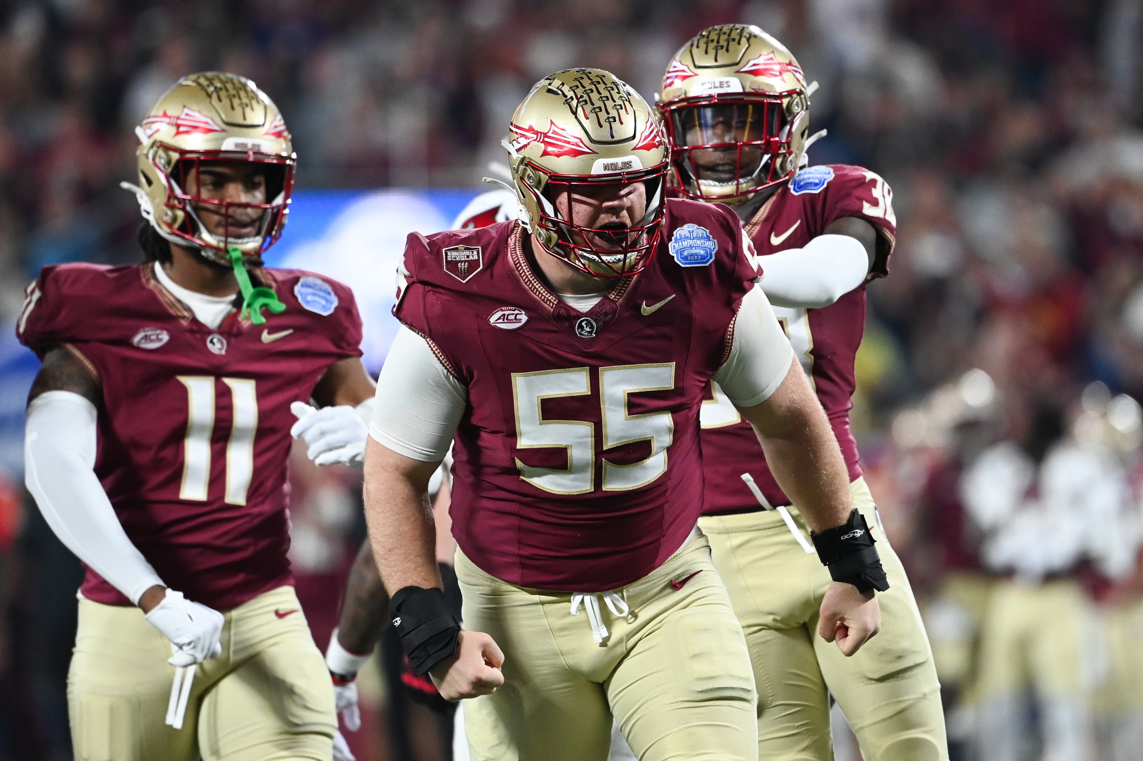 Dec 2, 2023; Charlotte, NC, USA; Florida State Seminoles defensive lineman Braden Fiske (55) reacts after a tackle on Louisville Cardinals running back Jawhar Jordan (25) in the first quarter at Bank of America Stadium.