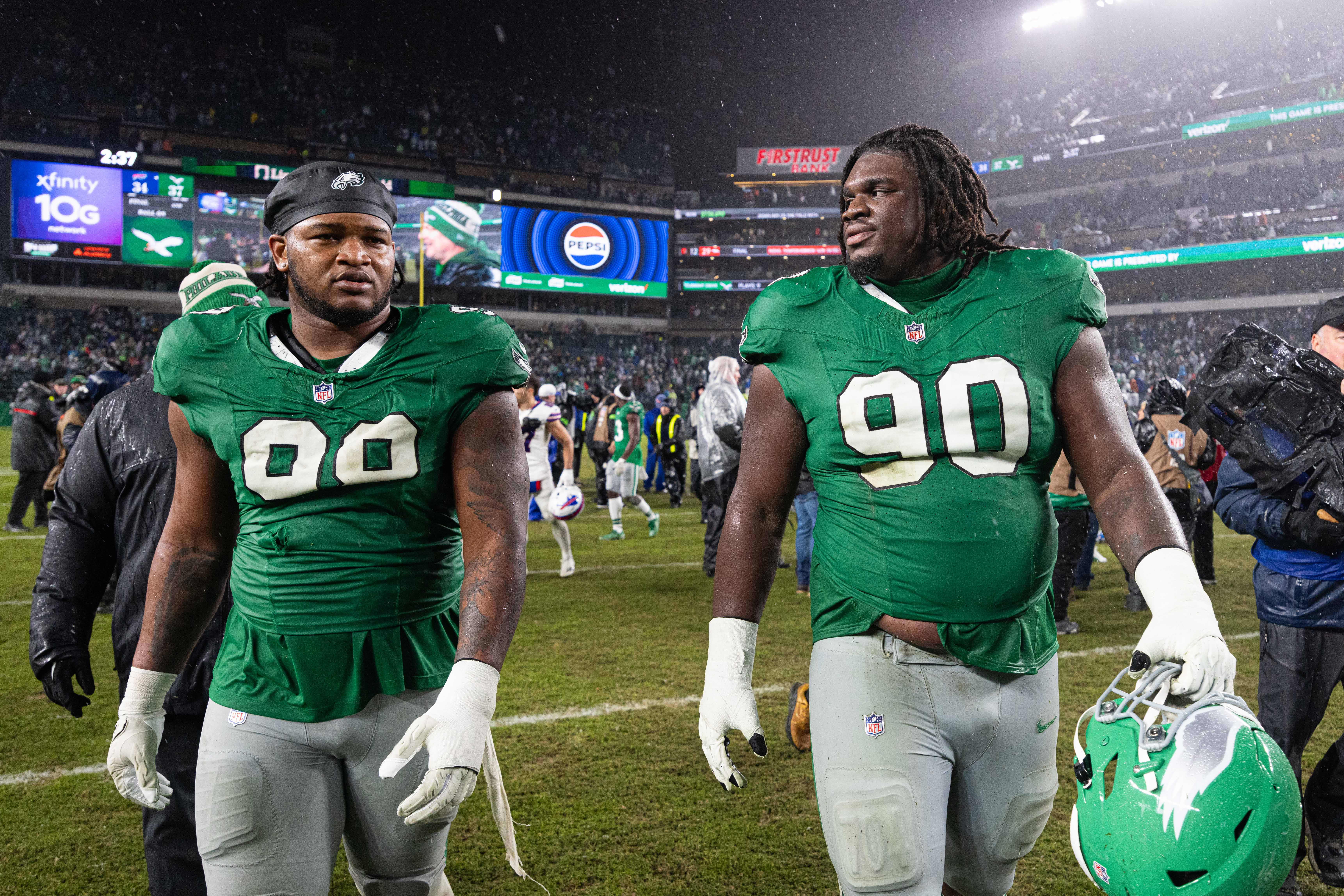 Philadelphia Eagles defensive tackle Jordan Davis (90) and defensive tackle Jalen Carter (98) walk off the field after a victory against the Buffalo Bills at Lincoln Financial Field.