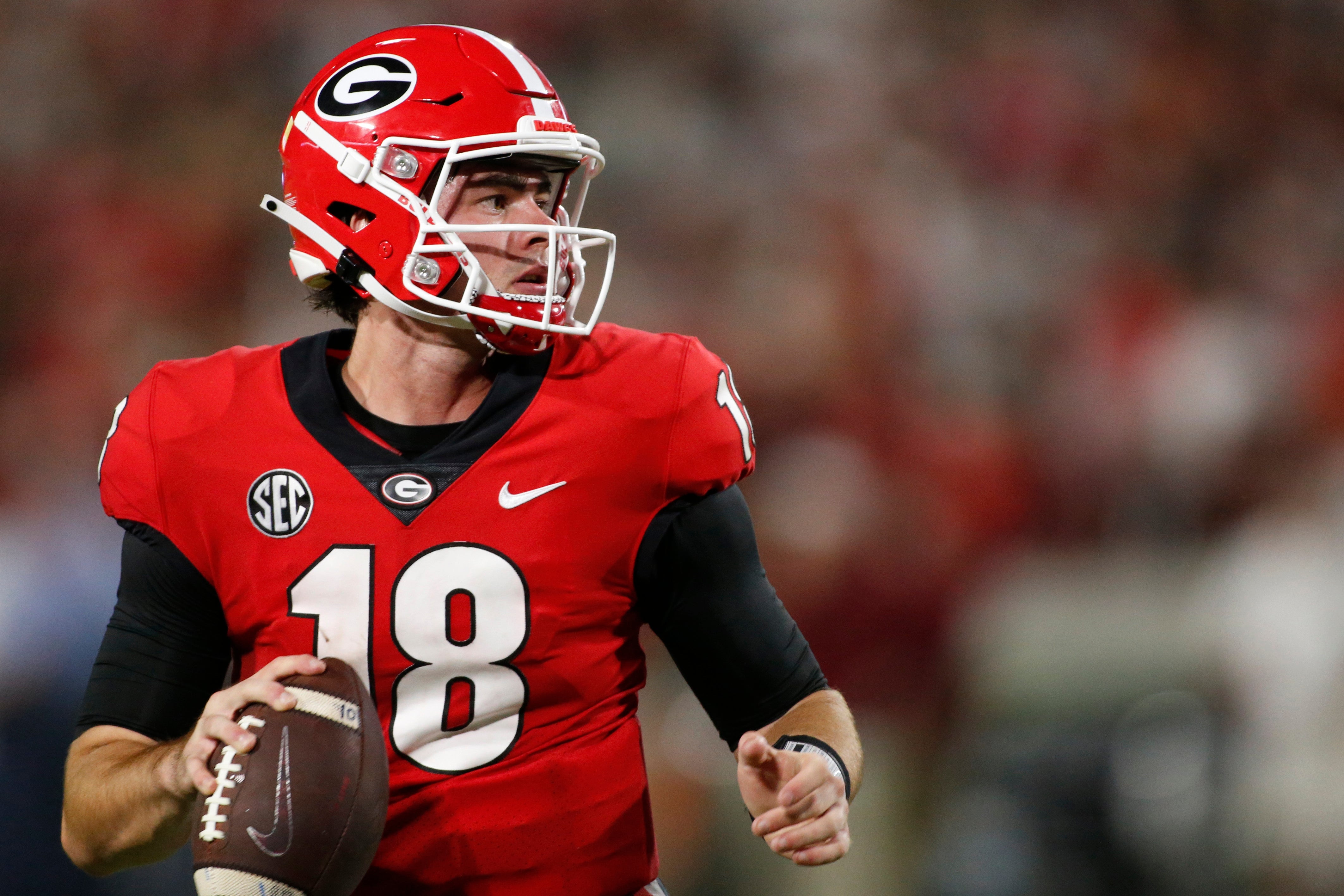 Georgia quarterback JT Daniels (18) looks to throw a pass during the second half of an NCAA college football game between South Carolina and Georgia in Athens, Ga., on Sept. 18, 2021. Georgia won 40-13.