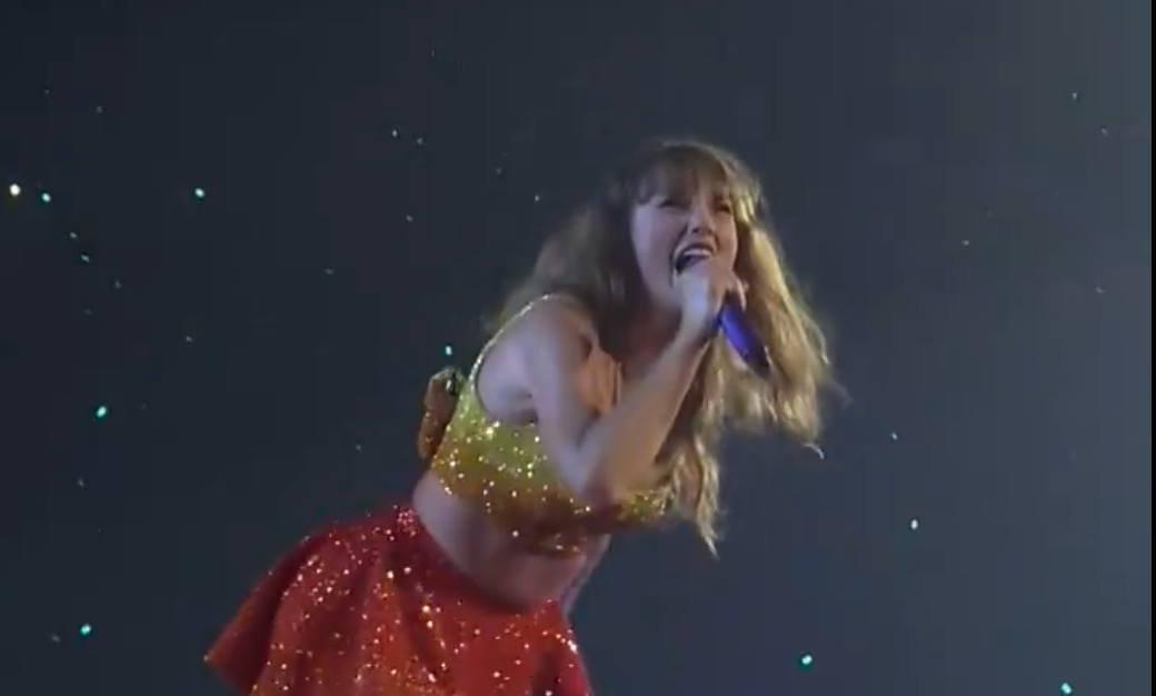 Taylor Swift wears a yellow and red outfit during the 1989 set of the Eras Tour during her 87th show