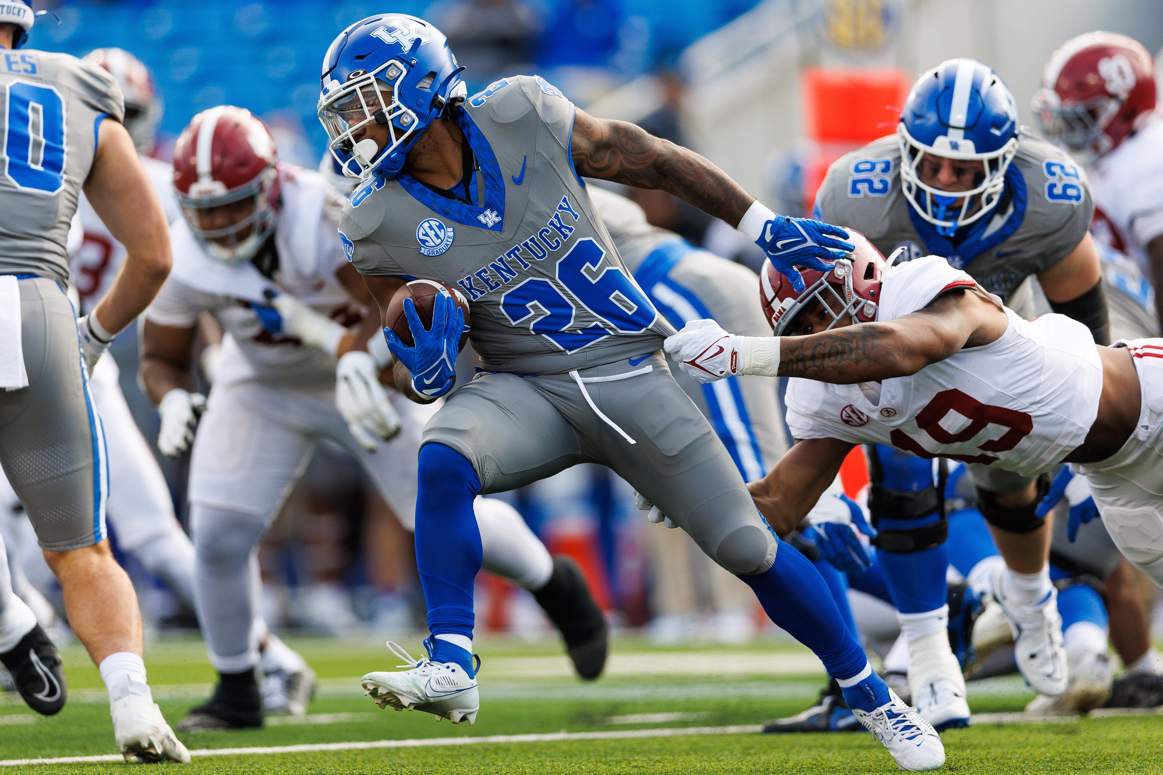 Nov 11, 2023; Lexington, Kentucky, USA; Kentucky Wildcats running back Ramon Jefferson (26) evades Alabama Crimson Tide linebacker Keanu Koht (19) during the fourth quarter at Kroger Field.