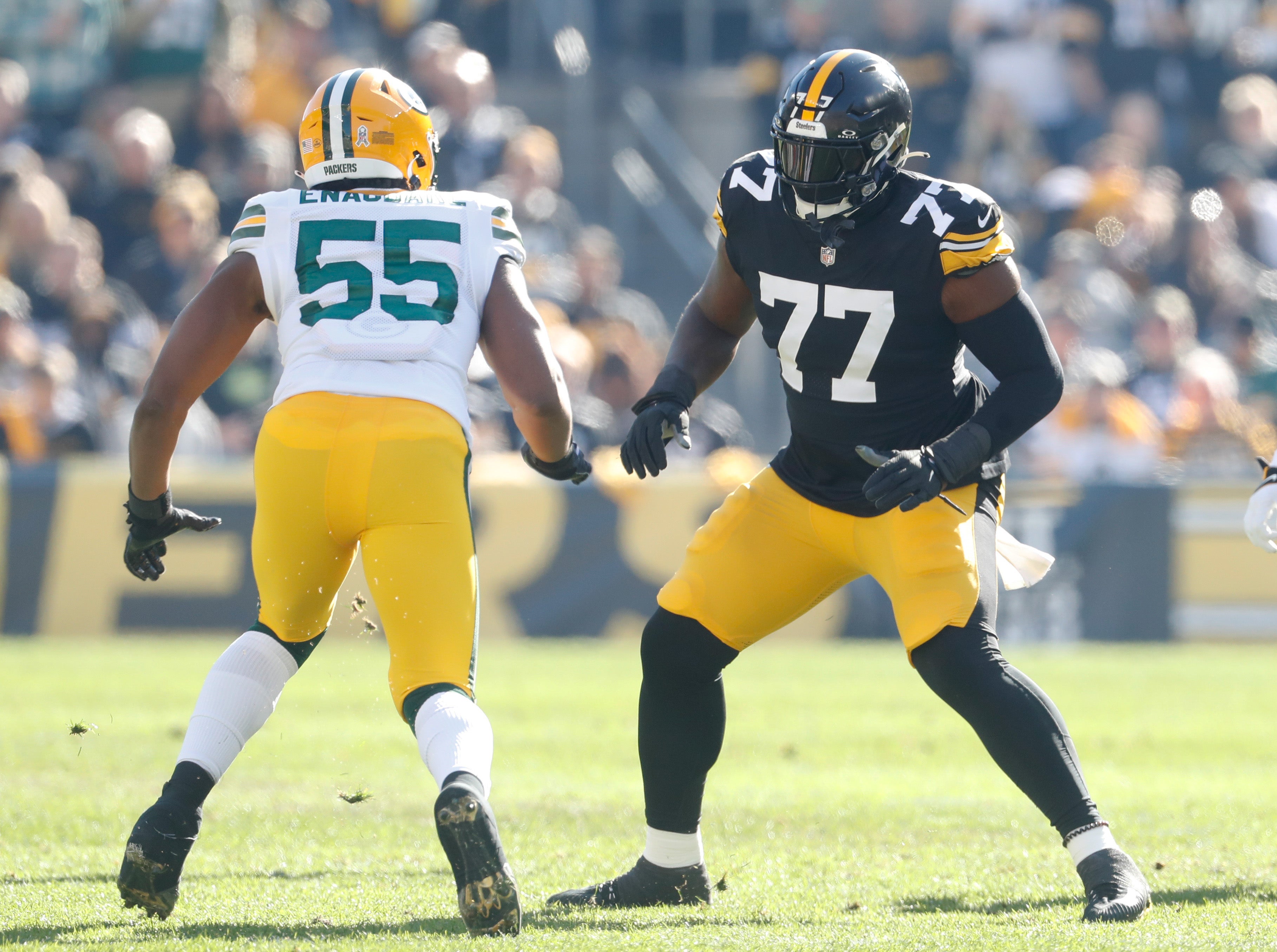Nov 12, 2023; Pittsburgh, Pennsylvania, USA; Pittsburgh Steelers offensive tackle Broderick Jones (77) blocks at the line of scrimmage against Green Bay Packers linebacker Kingsley Enagbare (55) during the first quarter at Acrisure Stadium. Mandatory Credit: Charles LeClaire-USA TODAY Sports