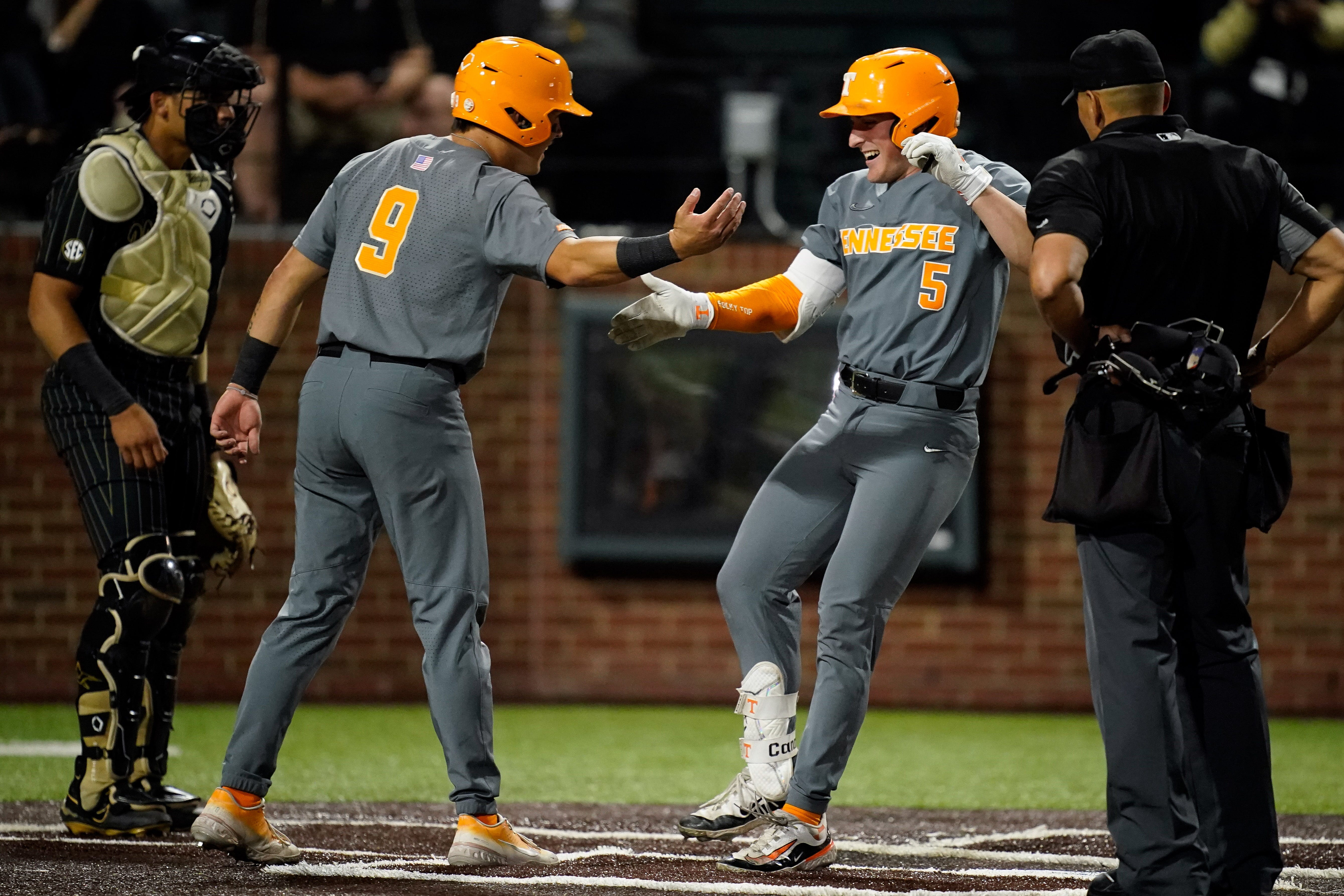 Tennessee catcher Cannon Peebles (5) celebrates his two-run home run against Tennessee with center fielder Hunter Ensley (9) during the eighth inning at Hawkins Field in Nashville, Tenn., Friday, May 10, 2024.