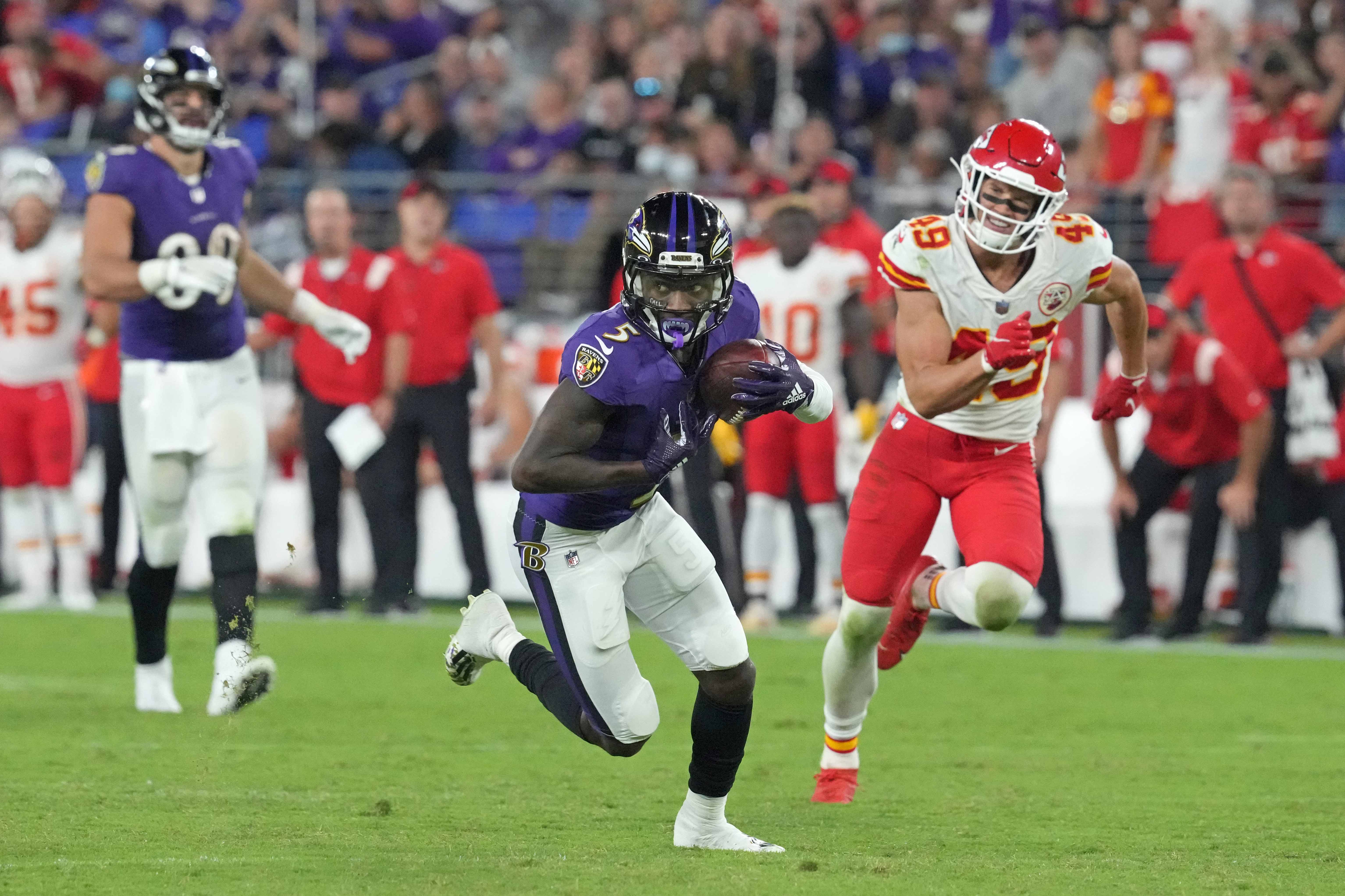 Sep 19, 2021; Baltimore, Maryland, USA; Baltimore Ravens wide receiver Marquise Brown (5) scores a third quarter touchdown defended by Kansas City Chiefs safety Daniel Sorensen (49) at M&T Bank Stadium.