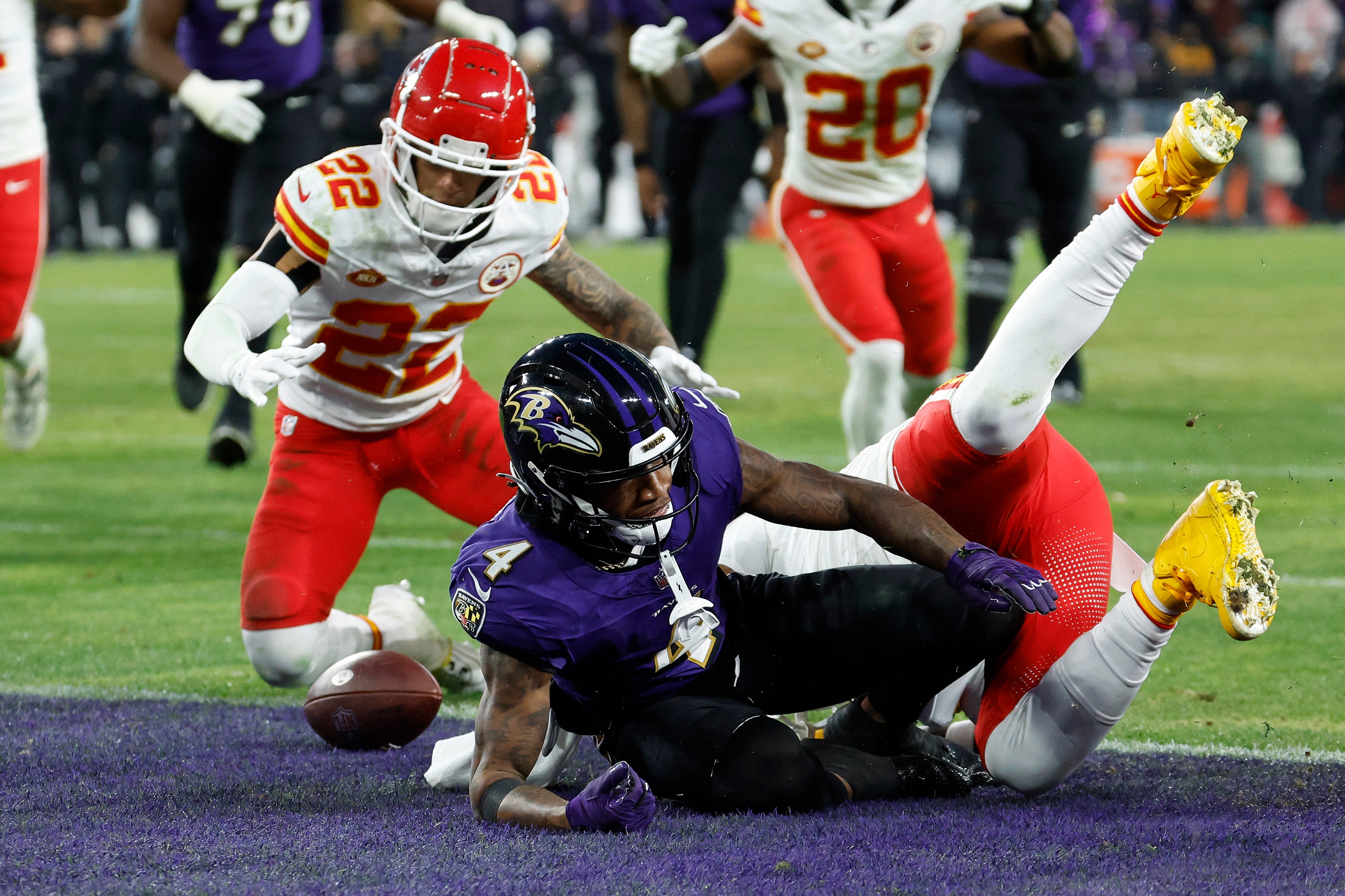 Jan 28, 2024; Baltimore, Maryland, USA; Baltimore Ravens wide receiver Zay Flowers (4) fumbles the ball as Kansas City Chiefs cornerback Trent McDuffie (22) recovers the fumble during the second half in the AFC Championship football game at M&T Bank Stadium.