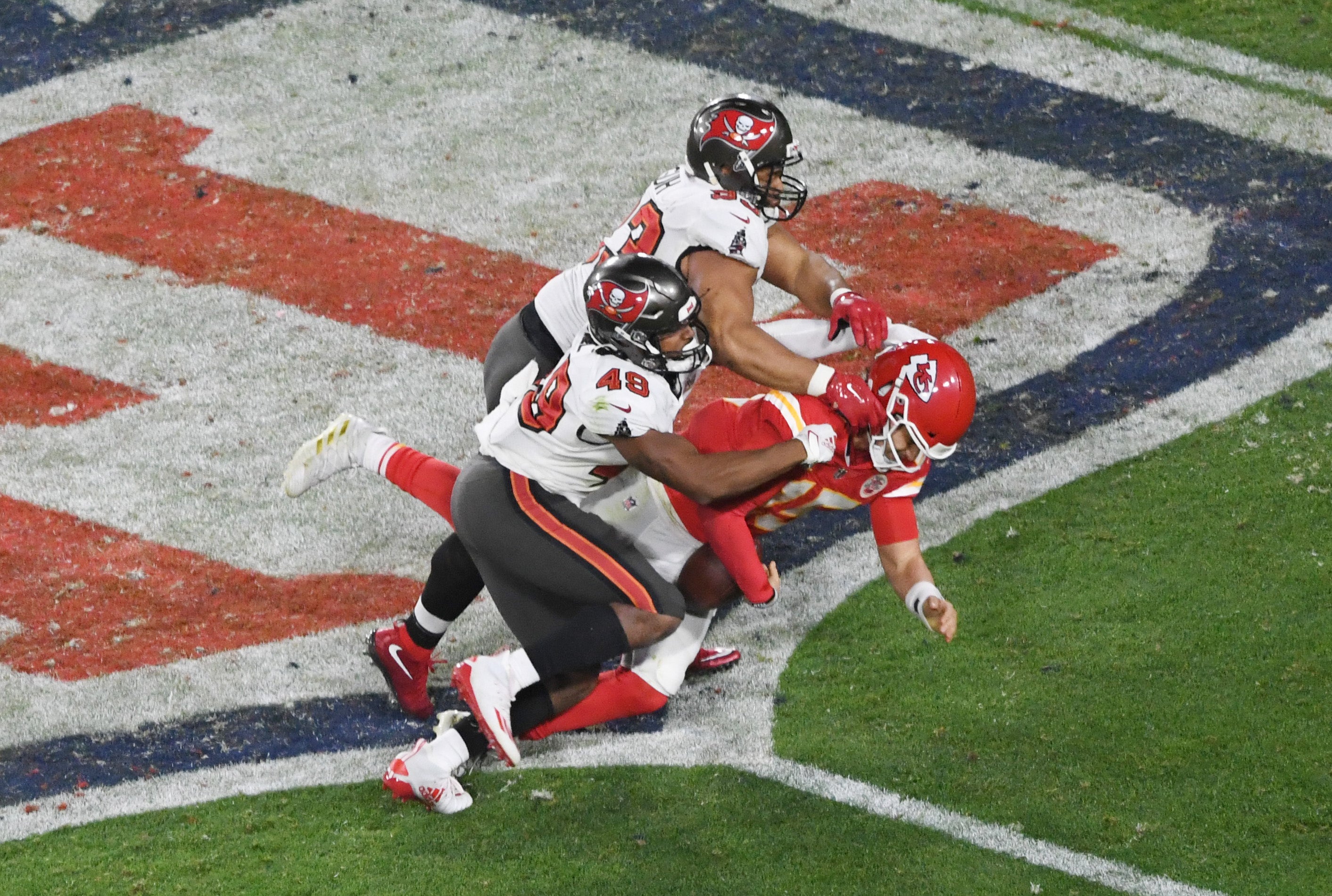 Feb 7, 2021; Tampa, FL, USA; Kansas City Chiefs quarterback Patrick Mahomes (15) is cackled by Tampa Bay Buccaneers defensive end Ndamukong Suh (93) and linebacker Cam Gill (49) in the fourth quarter of Super Bowl LV at Raymond James Stadium.