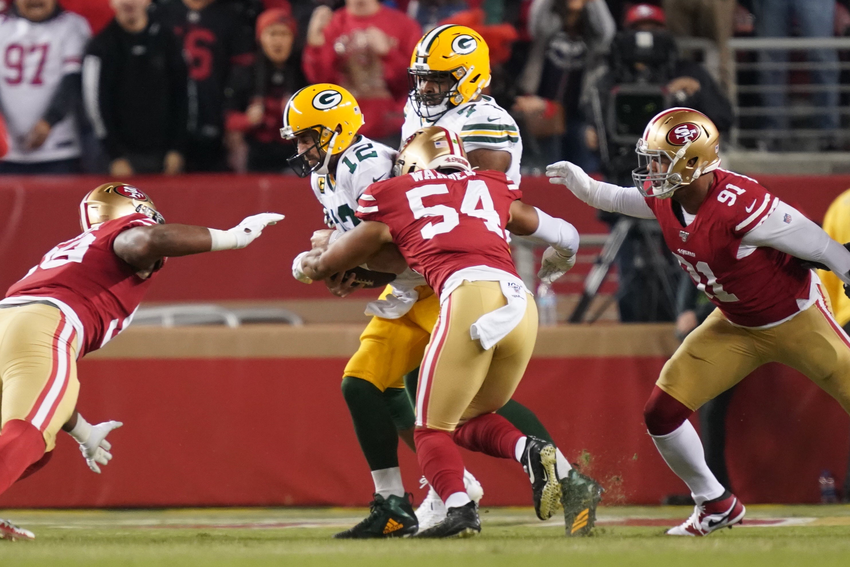 November 24, 2019; Santa Clara, CA, USA; Green Bay Packers quarterback Aaron Rodgers (12) is sacked by San Francisco 49ers middle linebacker Fred Warner (54) creating a fumble during the first quarter at Levi's Stadium.