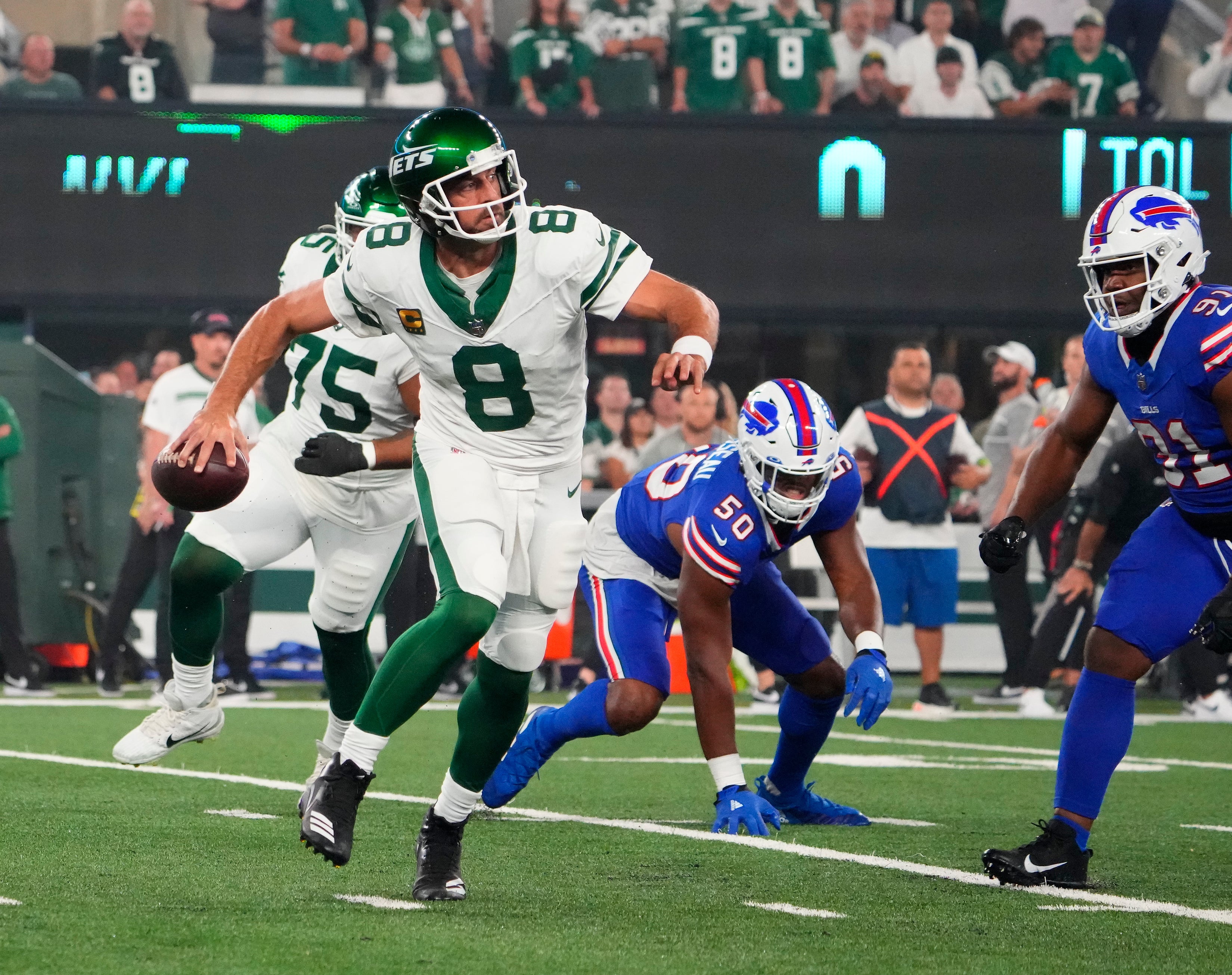 Buffalo Bills defensive end Greg Rousseau (50) pressures New York Jets quarterback Aaron Rodgers (8) during the first quarter at MetLife Stadium.