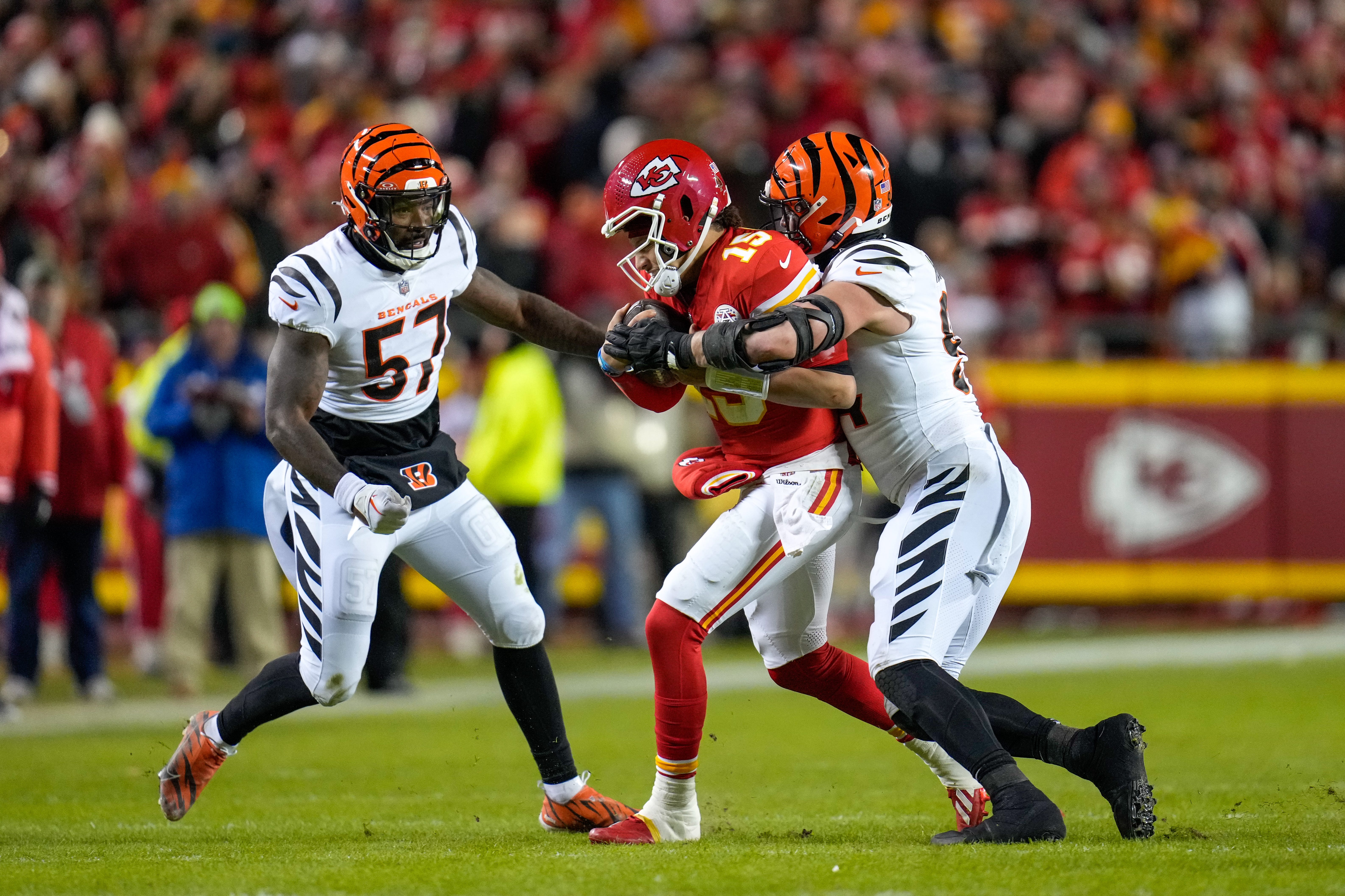 Cincinnati Bengals defensive end Sam Hubbard (94) wraps up Kansas City Chiefs quarterback Patrick Mahomes (15) in the fourth quarter of the NFL Week 17 game between the Kansas City Chiefs and the Cincinnati Bengals at Arrowhead Stadium in Kansas City, Mo., on Sunday, Dec. 31, 2023. The Chiefs won 25-17 to clinch the AFC West Championship.