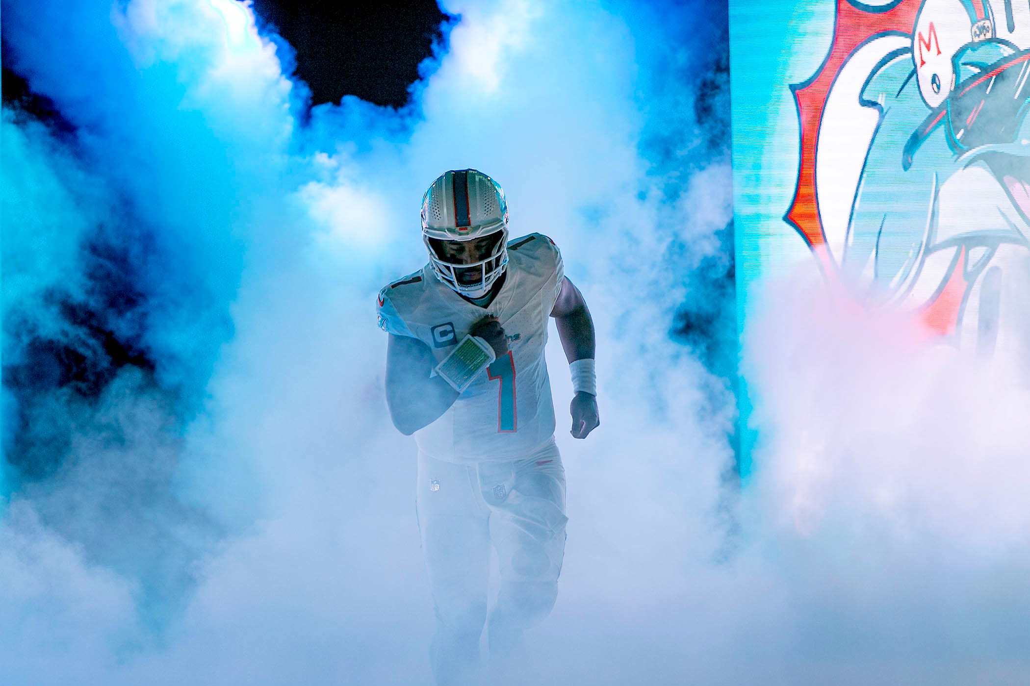 Miami Dolphins quarterback Tua Tagovailoa (1), enter the field before the start of their game against the Buffalo Bills during NFL football game Jan 07, 2024, in Miami Gardens.